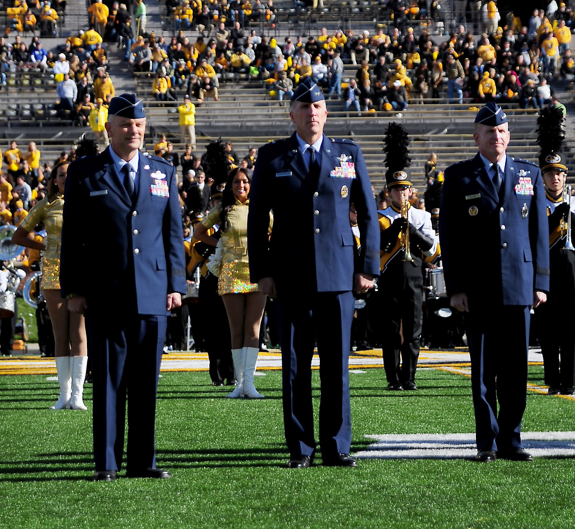 From left, Brig. Gen. Glen VanHerck, 509th Bomb Wing commander, Maj. Gen. Scott Vanderhamm, Eighth Air Force commander, and Lt. Gen. Stephen Wilson, Air Force Global Strike Command commander, stand on Faurot Field in Columbia, Mo., during the University of Missouri’s military appreciation game Nov. 1, 2014. More than 800 members from Whiteman Air Force Base, Mo. participated in the game and pre-game events. (U.S. Air Force photo by Maj. John Severns/Released)