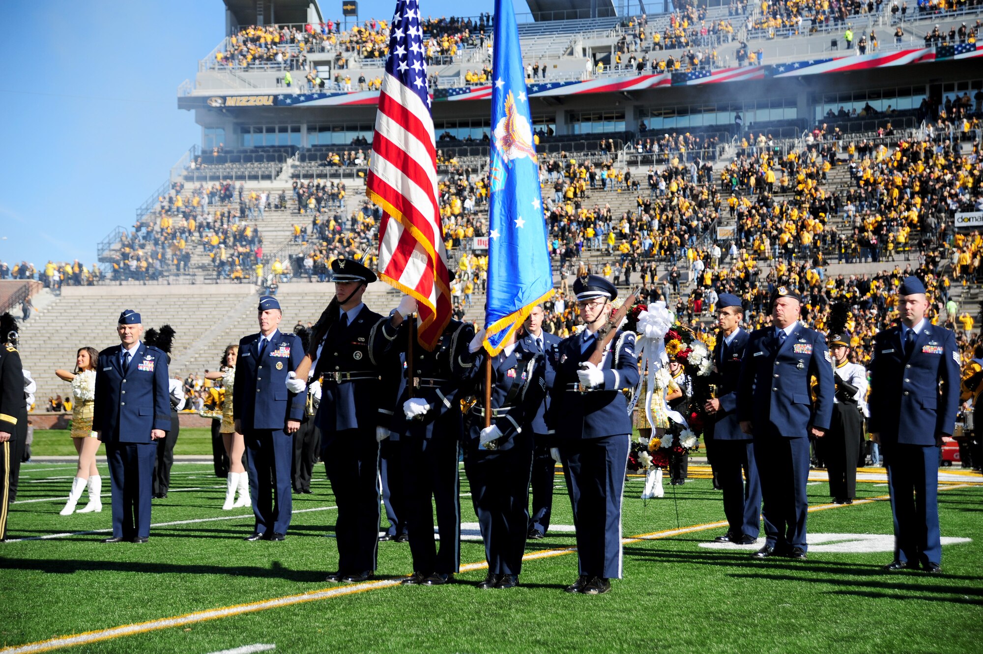Honor Guard members from Whiteman Air Force Base, Mo., present the colors during the University of Missouri’s military appreciation game in Columbia, Mo., Nov. 1, 2014. The pre-game ceremony was dedicated to honoring America’s veterans. (U.S. Air Force photo by Maj. John Severns/Released)