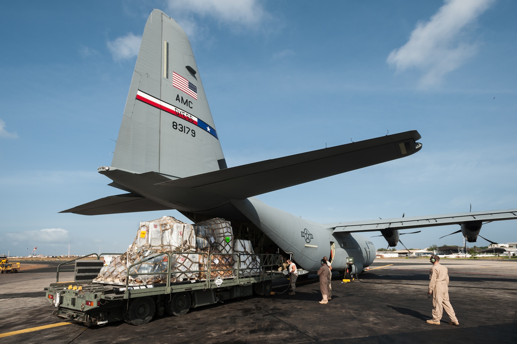 Aerial porters from the Kentucky Air National Guard’s 123rd Contingency Response Group load 8 tons of humanitarian aid and military supplies onto a U.S. Air Force C-130 aircraft at Léopold Sédar Senghor International Airport in Dakar, Senegal, Nov. 4, 2014. The aircraft and crew, from Dyess Air Force Base Texas, are deployed to Senegal as part of the 787th Air Expeditionary Squadron and will fly the cargo into Monrovia, Liberia, in support of Operation United Assistance, the U.S. Agency for International Development-led, whole-of-government effort to contain the Ebola virus outbreak in West Africa. (U.S. Air National Guard photo by Maj. Dale Greer)