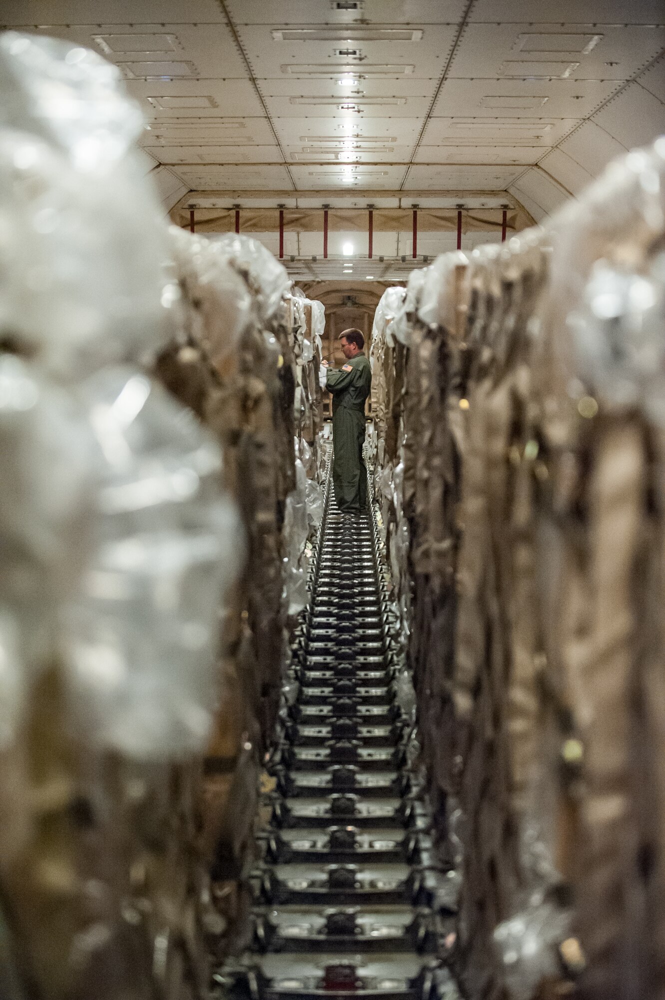 U.S. Air Force Master Sgt. Adam Keller, a ramp coordinator for the Kentucky Air National Guard’s 123rd Contingency Response Group, checks in-bound cargo against a manifest aboard a 747 cargo plane at Léopold Sédar Senghor International Airport in Dakar, Senegal, Nov. 2, 2014. The cargo, which includes humanitarian aid and troop-support equipment, will be off-loaded by Kentucky Air National Guardsmen and staged in a nearby cargo yard before being airlifted to Liberia aboard U.S. Air Force C-130s in support of Operation United Assistance, the U.S. Agency for International Development-led, whole-of-government effort to contain the Ebola virus outbreak in West Africa. (U.S. Air National Guard photo by Maj. Dale Greer)