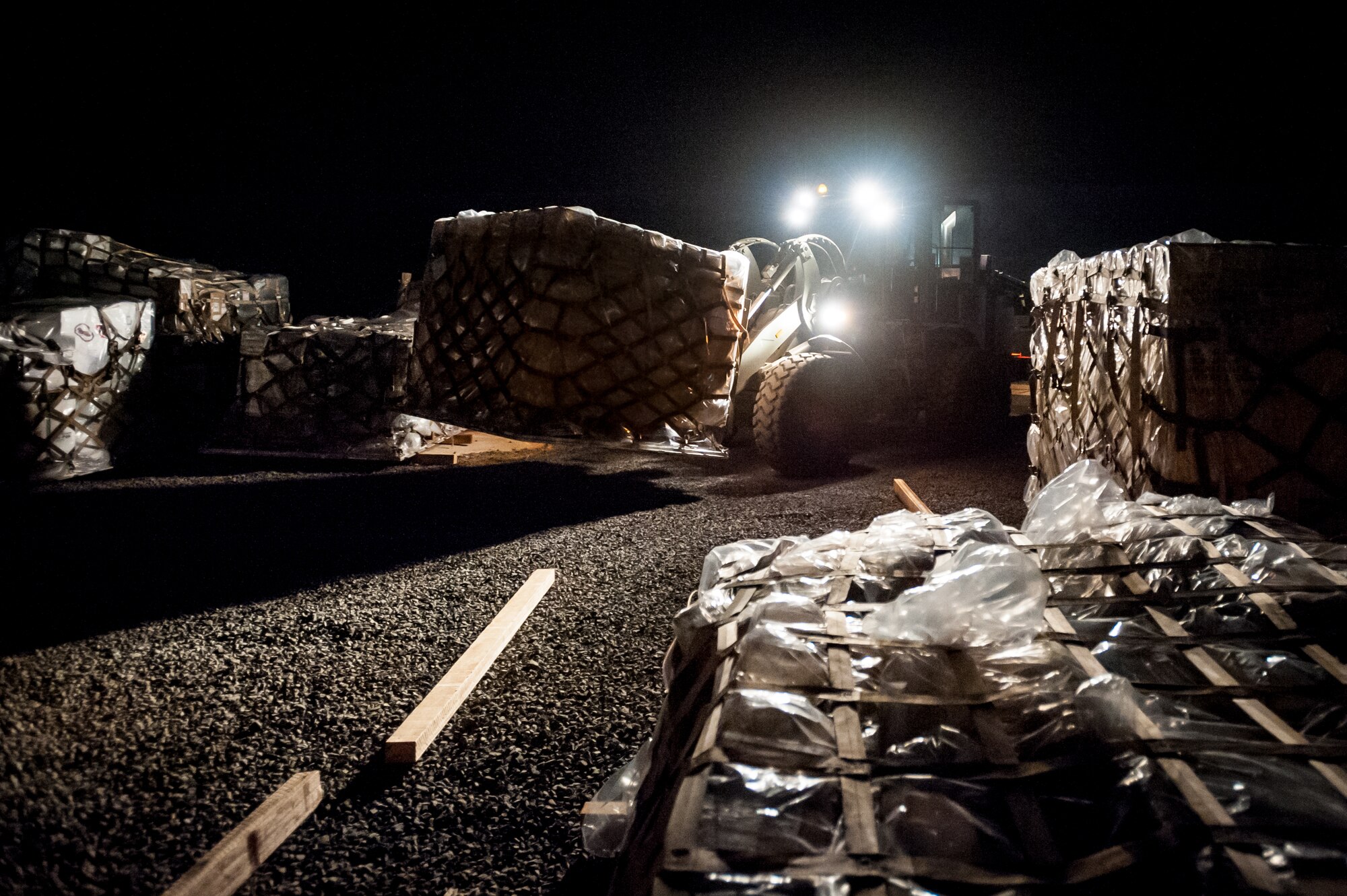 An aerial porter from the Kentucky Air National Guard’s 123rd Contingency Response Group places a pallet of in-bound humanitarian aid in the cargo yard of Joint Task Force-Port Opening Senegal at Léopold Sédar Senghor International Airport in Dakar, Senegal, Nov. 2, 2014. The cargo, which includes medical supplies and troop-support equipment, will be airlifted to Liberia aboard U.S. Air Force C-130s in support of Operation United Assistance, the U.S. Agency for International Development-led, whole-of-government effort to contain the Ebola virus outbreak in West Africa. (U.S. Air National Guard photo by Maj. Dale Greer)