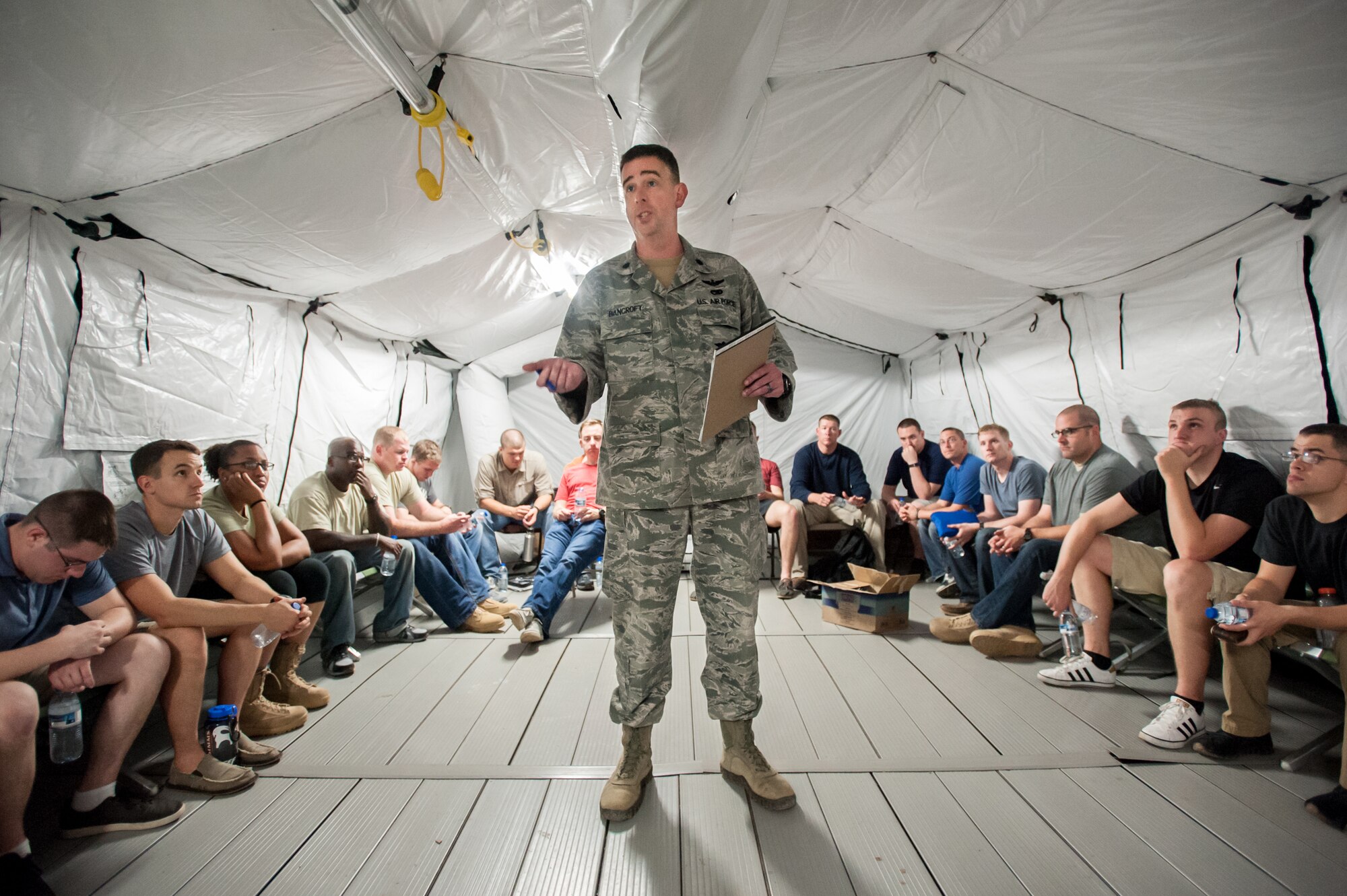 U.S. Air Force Lt. Col. Bruce Bancroft of the Kentucky Air National Guard’s 123rd Contingency Response Group briefs Airmen as they arrive at Léopold Sédar Senghor International Airport in Dakar, Senegal, Nov. 2, 2014. The Airmen, from Dyess Air Force Base, Texas, are standing up the 787th Air Expeditionary Squadron to fly humanitarian aid and military support cargo into Liberia as part of Operation United Assistance, the U.S. Agency for International Development-led, whole-of-government effort to contain the Ebola virus outbreak in West Africa. (U.S. Air National Guard photo by Maj. Dale Greer)
