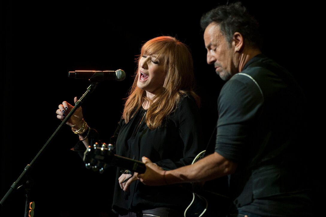 Musician Bruce Springsteen and his wife, Patti Scialfa, perform during the Stand Up for Heroes special at Madison Square Garden in New York, Nov. 5, 2014. 