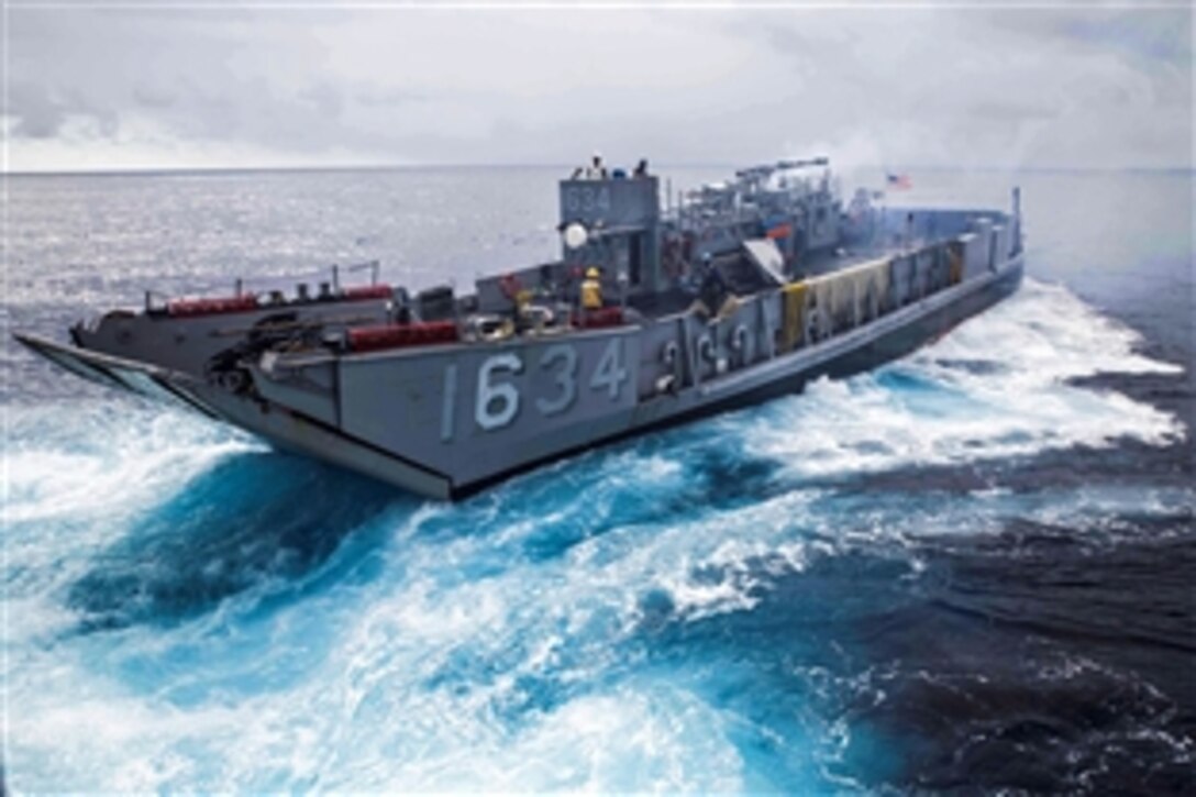 A U.S. Navy Landing Craft Unit disembarks the USS Germantown during exercise Blue Chromite 15 on Camp Schwab, Okinawa, Japan, Nov. 4, 2014. Blue Chromite demonstrates the Navy and Marine Corps’ amphibious and expeditionary capabilities from the sea. 