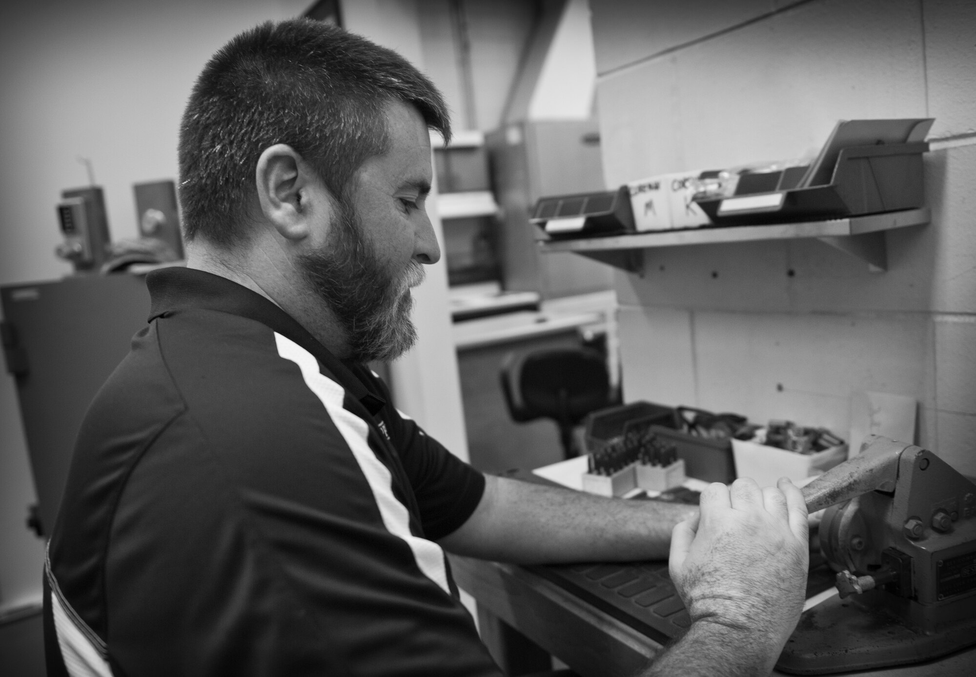 David Console, 1st Special Operations Civil Engineer Squadron locksmith, cuts a key at the locksmith shop on Hurlburt Field, Fla., Nov. 6, 2014. Console makes around 200 keys a month for any and all of Hurlburt's units. (U.S. Air Force photo/Senior Airman Krystal M. Garrett) 