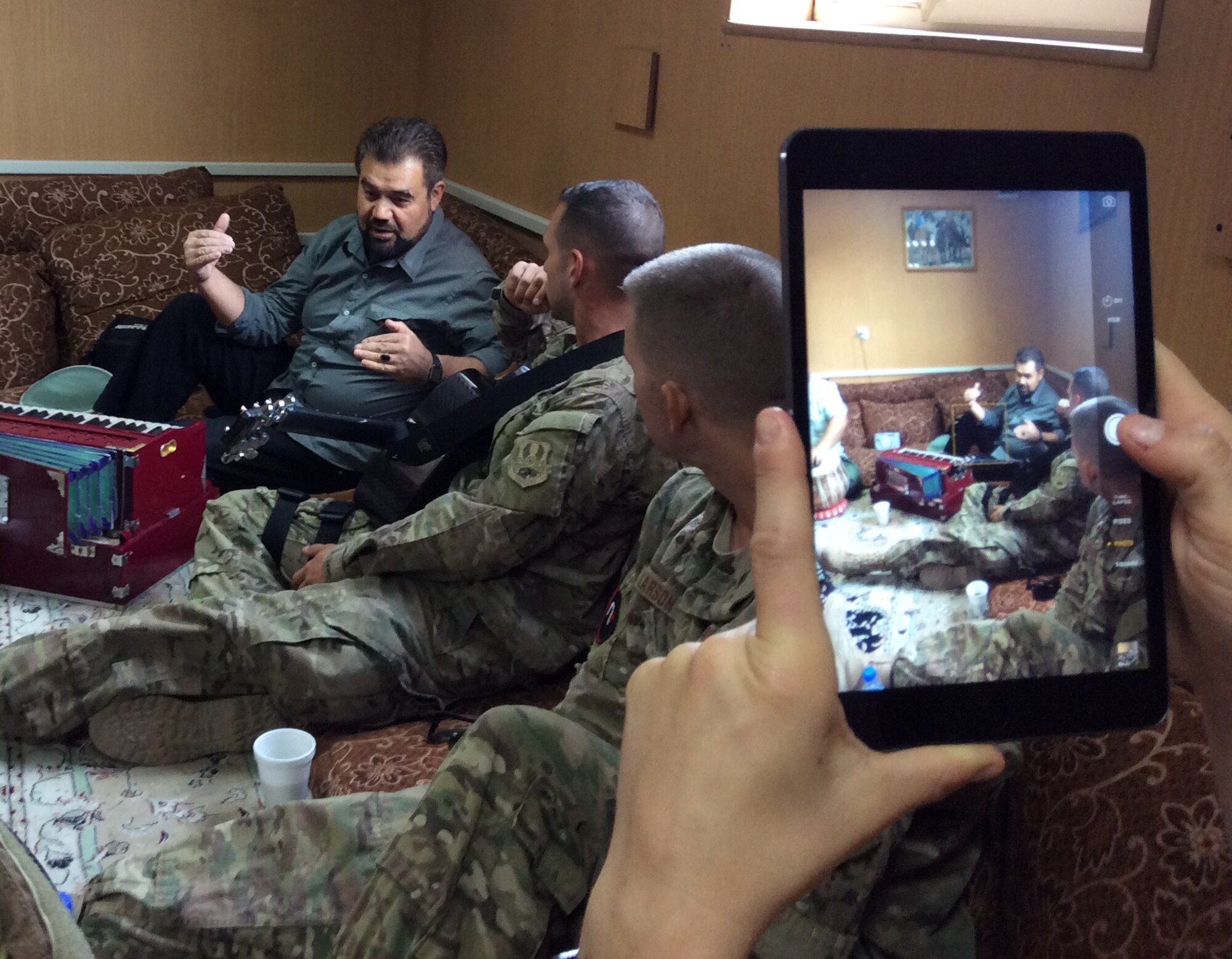 Staff Sgt. Alex Nikiforoff and Senior Master Sgt. Stephen Larson of the U.S. Air Force Central Command Band, Touch 'N Go, rehearse with Afghan musician Sayed Homayoun Alimi in Kabul, Afghanistan, for for a performance
on Bayan Radio Oct 13, 2014.  Touch 'N Go made history as the first ensemble of western musicians to ever be featured on Bayan Radio in Afghanistan, which is the second largest radio station in the country. (Courtesy photo)