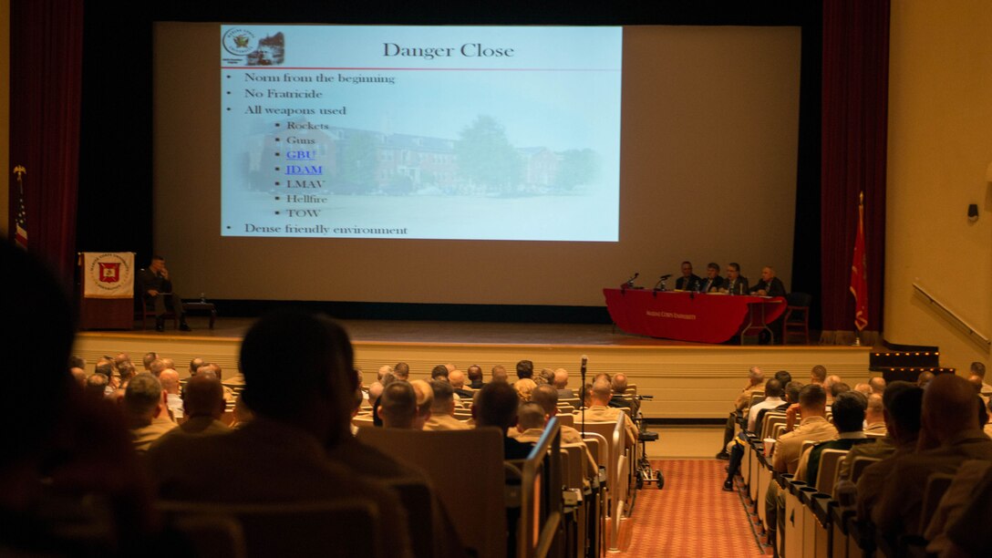 Service members of all ranks and some from different countries listen to the leaders of Operation al-Fajr speak during The General Graves B. Erskine Distinguished Lecture Series panel discussion at Marine Corps Base Quantico, Va., on October 30, 2014. Retired Marine Lt. Gen. John F. Sattler, former Commanding General of I MEF, retired Marine Lt. Gen. Richard F. Natonski, former Commanding General of 1st Marine Division, retired Marine Lt. Gen. Keith J. Stalder, former Commanding General of 3rd Marine Aircraft Wing and retired Marine Lt. Gen. Richard S. Kramlich, former Commanding General of 1st Force Service Support Group.