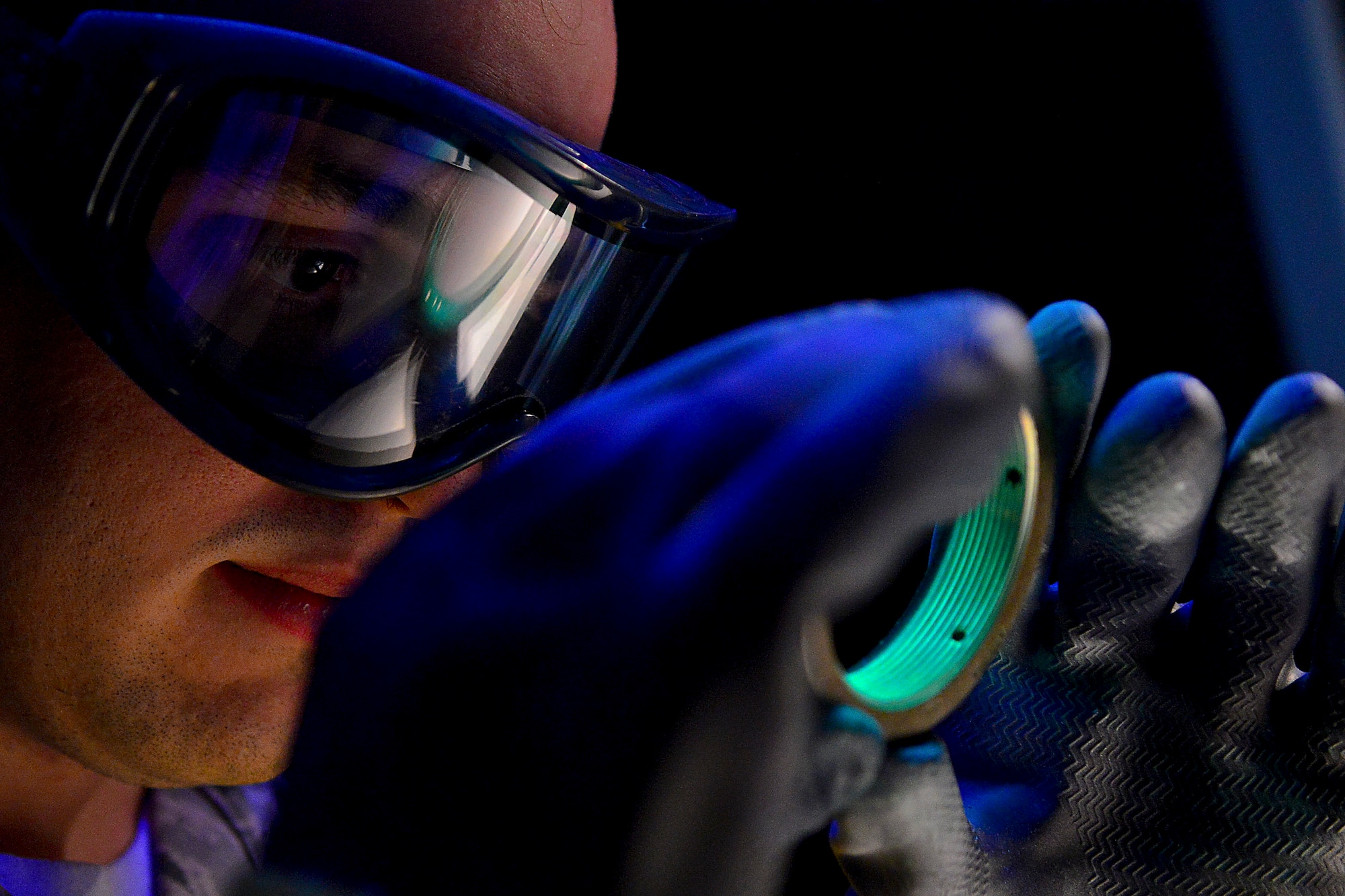 Airman 1st Class Michael Griffin utilizes a stationary penetrant line Nov. 3, 2014,  at Langley Air Force Base, Va. A penetrant is used to detect discontinuities, such as cracks and pits, open to the surface on parts made of nonporous materials. Griffin is a 1st Maintenance Squadron nondestructive inspection technician. (U.S. Air Force photo/Staff Sgt. Antoinette Gibson)