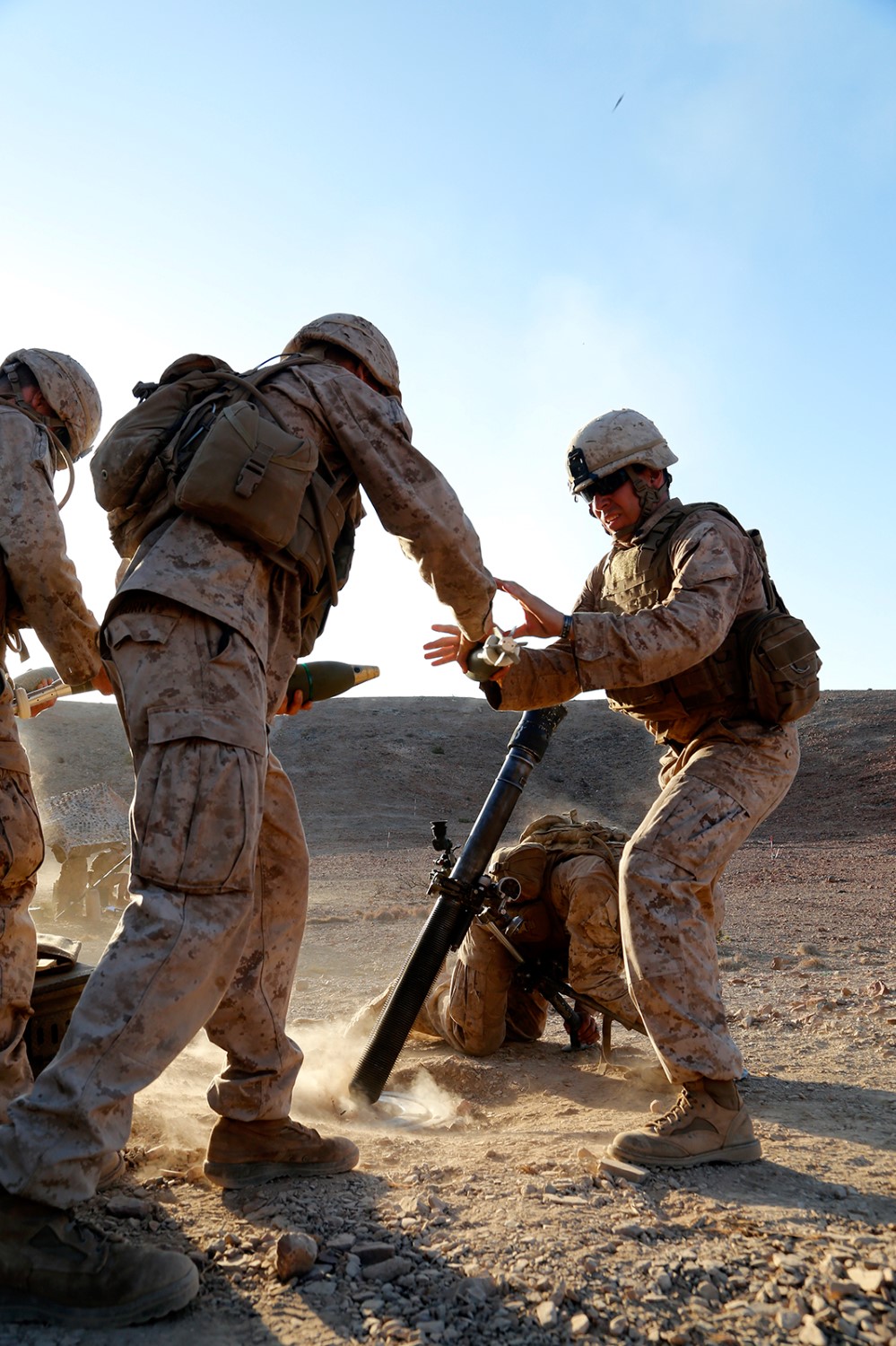 U.S. Marines with Weapons Company, Battalion Landing Team 2nd Battalion, 1st Marines, 11th Marine Expeditionary Unit (MEU), prepare to drop high explosive mortar rounds during a live-fire fire for effect exercise as part of sustainment training at D’Arta Plage, Djibouti, Nov. 5. The 11th MEU is deployed as a theater reserve and crisis response force throughout U.S. Central Command and the U.S. 5th Fleet area of responsibility. (U.S. Marine Corps photos by Gunnery Sgt. Rome M. Lazarus/Released) 