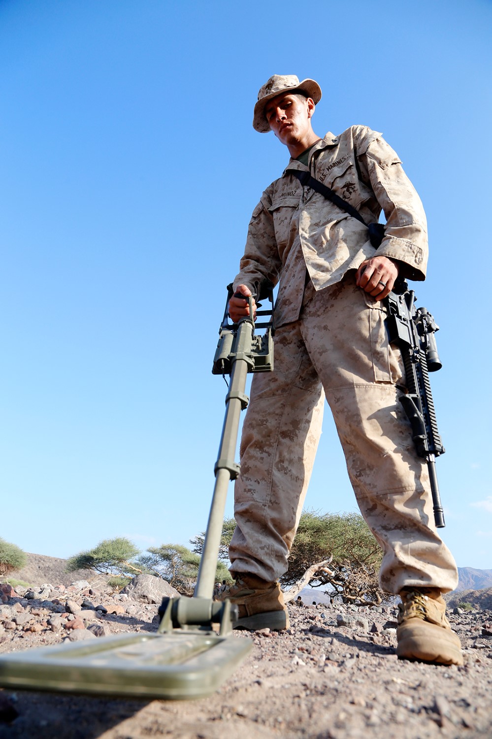 U.S. Marine Corps Lance Cpl. Jacob Munoz, an automatic rifleman with Fox Company, Battalion Landing Team 2nd Battalion, 1st Marines, 11th Marine Expeditionary Unit (MEU), and native of El Paso, Texas, scans the ground with a compact metal detector during a counter-improvised explosive device exercise as part of sustainment training at D’Arta Plage, Djibouti, Nov. 6. The 11th MEU is deployed as a theater reserve and crisis response force throughout U.S. Central Command and the U.S. 5th Fleet area of responsibility. (U.S. Marine Corps photos by Gunnery Sgt. Rome M. Lazarus/Released) 