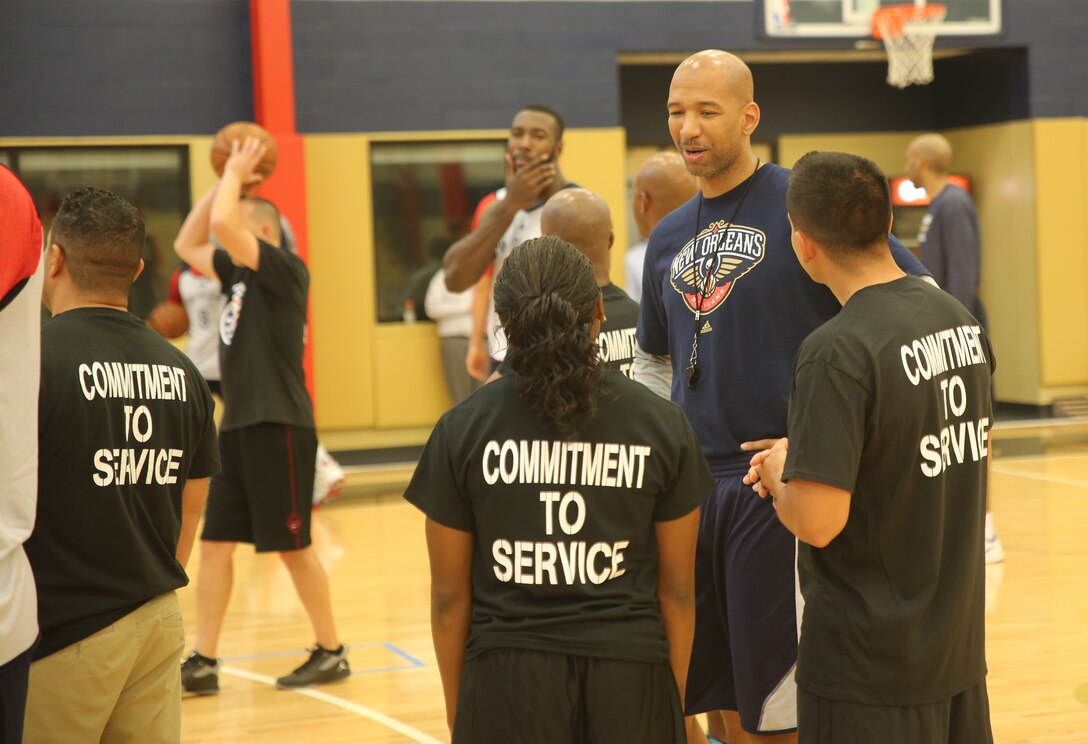 Monty Williams, New Orleans Pelicans head coach, speaks to Marines with Marine Forces Reserves during a practice session at the Pelicans’ practice facility in Metairie, La., Nov. 6, 2014. The Marines got the opportunity to practice with the players, tour the facility and eat lunch at the Pelicans’ cafeteria for NBA Cares Hoops for Troops Week.