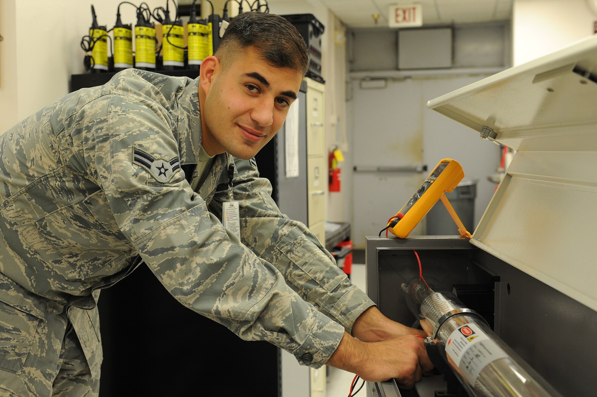 Airman 1st Class Theo Shakir fixes a broken piece of medical equipment Oct. 29, 2014, at Scott Air Force Base, Ill. Shakir is a 375th Medical Support Squadron biomedical equipment technician who was born in Iraq. He started his process of becoming a U.S. citizen three years ago when he joined the military. Despite some difficulties, he obtained his citizenship on Oct. 17, 2014. (U.S. Air Force photo/Senior Airman Sarah Hall-Kirchner)