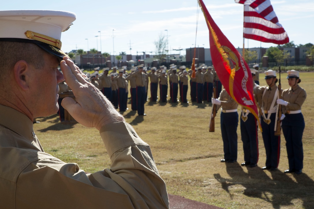 A Marine officer salutes the colors during the cake cutting ceremony in honor of the Marine Corps’ 239th birthday at Marine Corps Support Facility New Orleans, La., Nov. 7, 2014. The Marine Corps was founded Nov. 10, 1775 at Tun Tavern in Philadelphia, Pa.