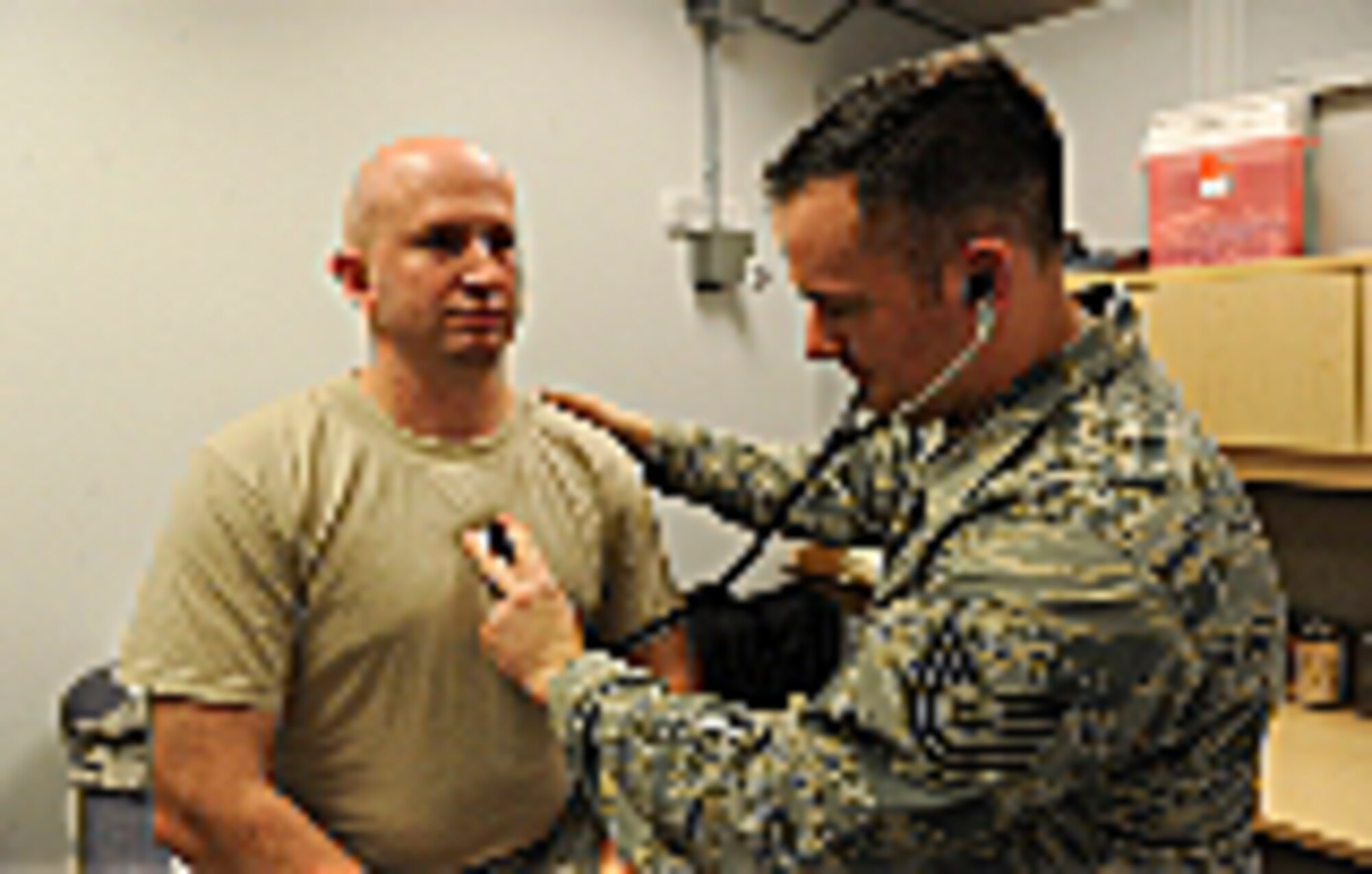 Tech. Sgt. Joseph Williams 1st Special operations Support Squadron independent duty medical technician, checks a patient at Hurlburt Field, Fl., Nov. 4, 2014. Williams is part of the operational medicine flights embedded into flying squadrons around Hurlburt Field. (U.S. Air Force photo/Airman 1st Class Andrea Posey)