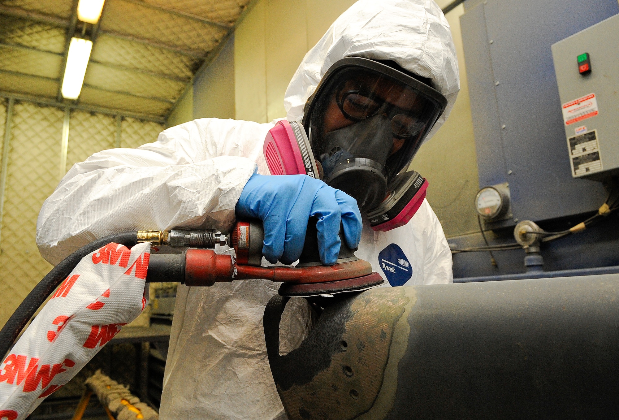 Airman 1st Class Shane Dan, 1st Special Operations Equipment Maintenance Squadron aircraft structural maintenance apprentice, sands a leading edge from a CV-22 Osprey on Hurlburt Field, Fla., Nov. 3, 2014. The corrosion control element prevents aircraft part failures by combating effects of environmental exposure and metal fatigue. (U.S. Air Force photo/Airman 1st Class Andrea Posey)