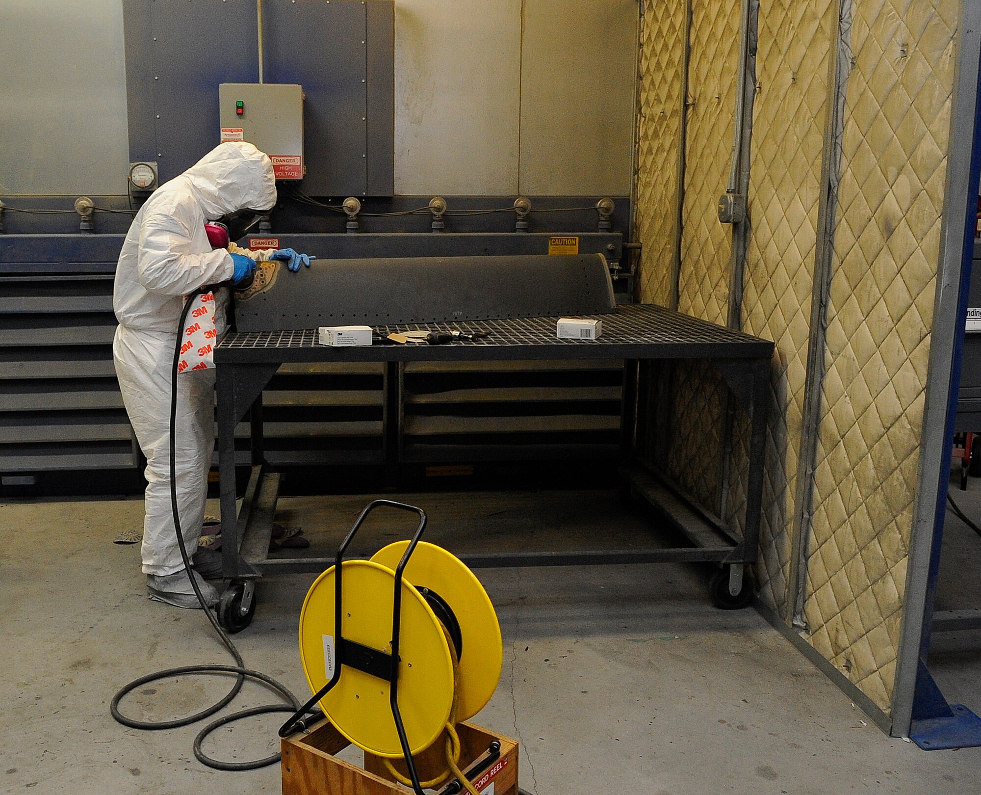 Airman 1st Class Shane Dan, 1st Special Operations Equipment Maintenance Squadron aircraft structural maintenance apprentice, sands a leading edge from a CV-22 Osprey on Hurlburt Field, Fla., Nov. 3, 2014. The leading edge must be smooth before a patch can be placed on the damaged area. (U.S. Air Force photo/Airman 1st Class Andrea Posey)