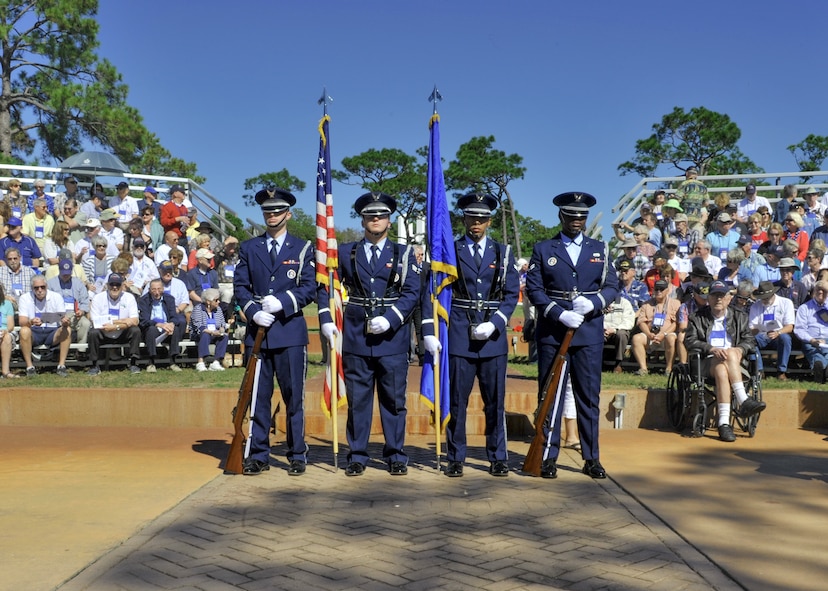 The Hurlburt Field Honor Guard stands ready to present the colors during a memorial ceremony at the Air Park on Hurlburt Field, Fla., Oct. 25, 2014. Nearly 300 former Forward Air Controllers, their families and friends, and Hurlburt Airmen paid tribute to those who lost their lives in past wars. (U.S. Air Force photo/Senior Airman Kentavist P. Brackin)
