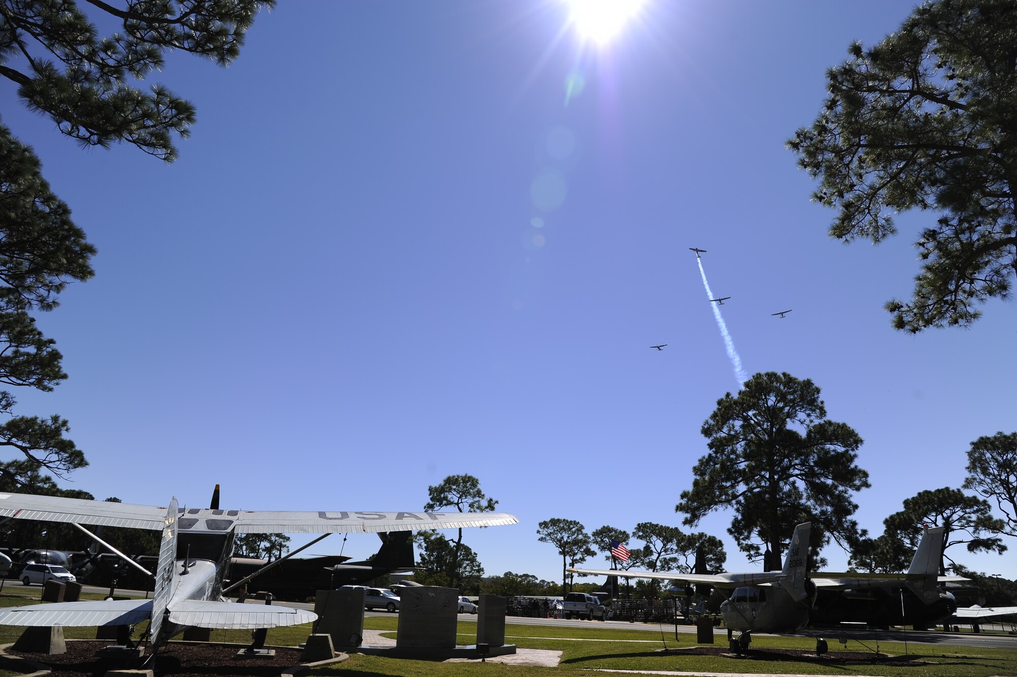Four 0-1 Bird Dogs flyover the Air Park at Hurlburt Field, Fla., Oct. 25, 2014. The flyover was part of a memorial ceremony for fallen Forward Air Controllers. (U.S. Air Force photo by/Sarah Hanson)