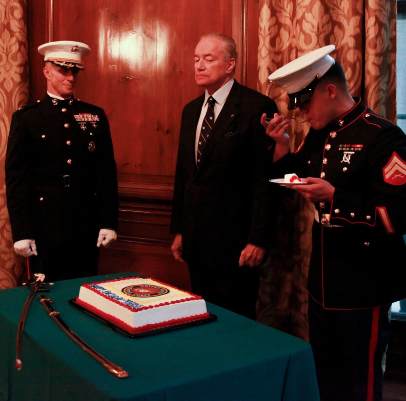 NEW YORK—Cpl. Teodoro Elizondo III, right, eats a piece of ceremonial cake during the Marine Corps birthday celebration at the Council of Foreign Relations Nov. 6 as Col. Stephen Liszewski  and Gui Wyser-Pratte look on. “Doing it here was important because there are a lot of civilians here and they never get to see anything like this so they get to be exposed to it and kind of understand what goes on in the Marine Corps,” said Col. Stephen Liszewski, the U.S. Marine Corps military fellow to the Council on Foreign Relations. Elizondo was the youngest Marine present at the event and Wyser-Pratte was the oldest Marine present. 