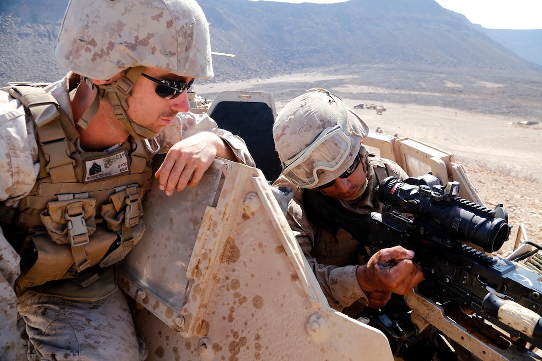 U.S. Marine Corps Lance Cpl. Vincent T. Carrillo, right, a landing support specialist with Combat Logistics Battalion 11, 11th Marine Expeditionary Unit (MEU), and native of Palmdale, California, makes ready a 240B medium machine gun as part of a live-fire static crew-served weapons range during sustainment training at D’Arta Plage, Djibouti, Nov. 5. Marines from the 11th MEU are deployed as a flexible, adaptable and persistent force in the U.S. 5th Fleet area of responsibility. (U.S. Marine Corps photos by Gunnery Sgt. Rome M. Lazarus/Released)