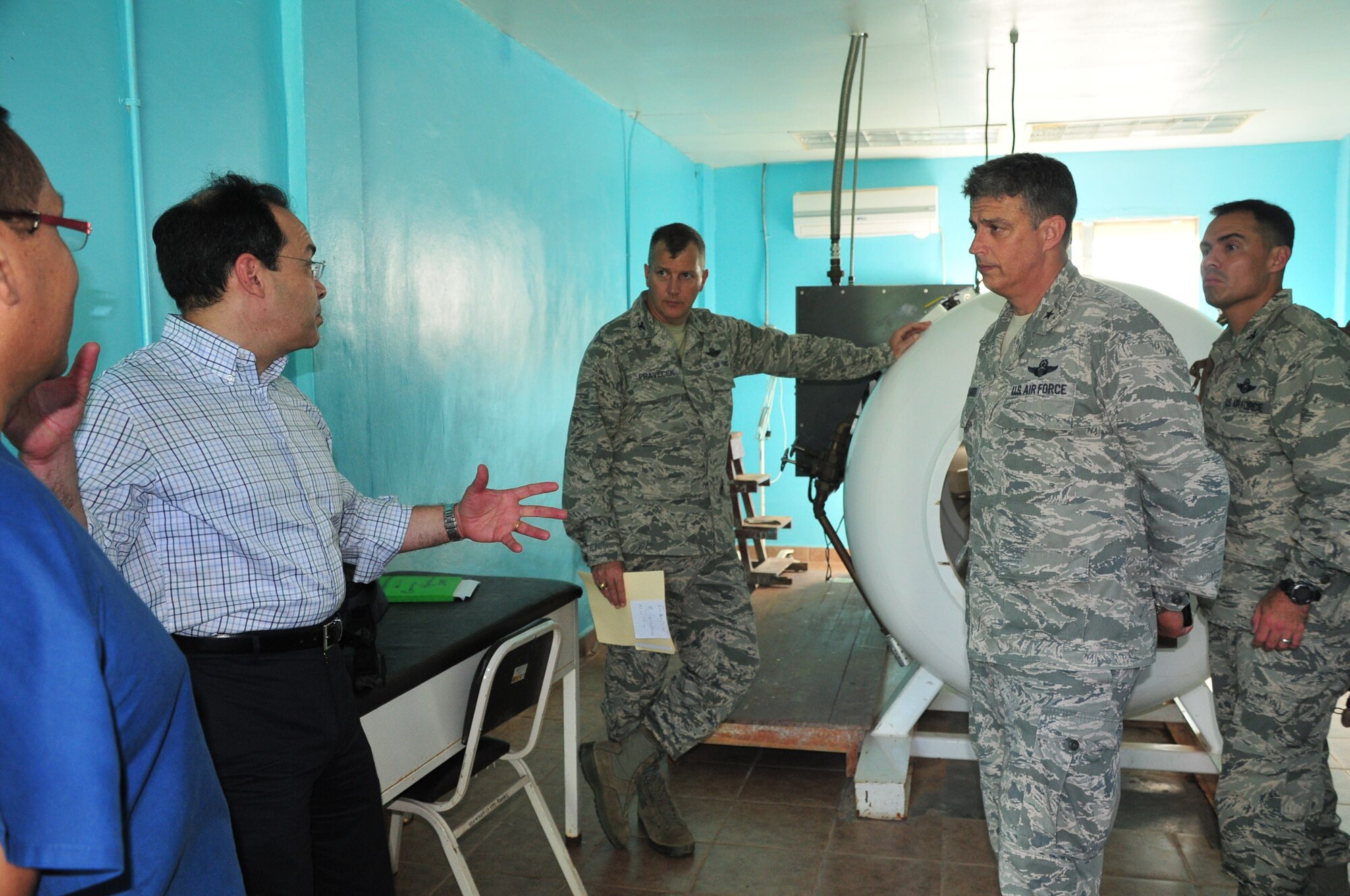Brig. Gen. Monteagudo received a tour of the Puerto Lempira Hospital facilities, to include  the hyperbaric chamber room, Oct. 5, 2014.  The hyperbaric chamber room was a donation provided by SOUTHCOM in 2008. The lobster industry is one of the main staples that support Puerto Lempira and the local area, and many divers who fish for the marine commodity have suffered from decompression sickness (DCS), also known as the bends. Exposure to DCS can produce many symptoms to include paralysis and death, but if treated early in a hyperbaric chamber, there is a significantly higher chance of successful recovery.  The donation was a critical aid to the Puerto Lempira region, and it emboldened SOUTHCOM's commitment to bring medical care and humanitarian assistance to Central America, further strengthening the partnership with the Hondurans. (U.S. Air Force photo/ Capt. Connie Dillon)