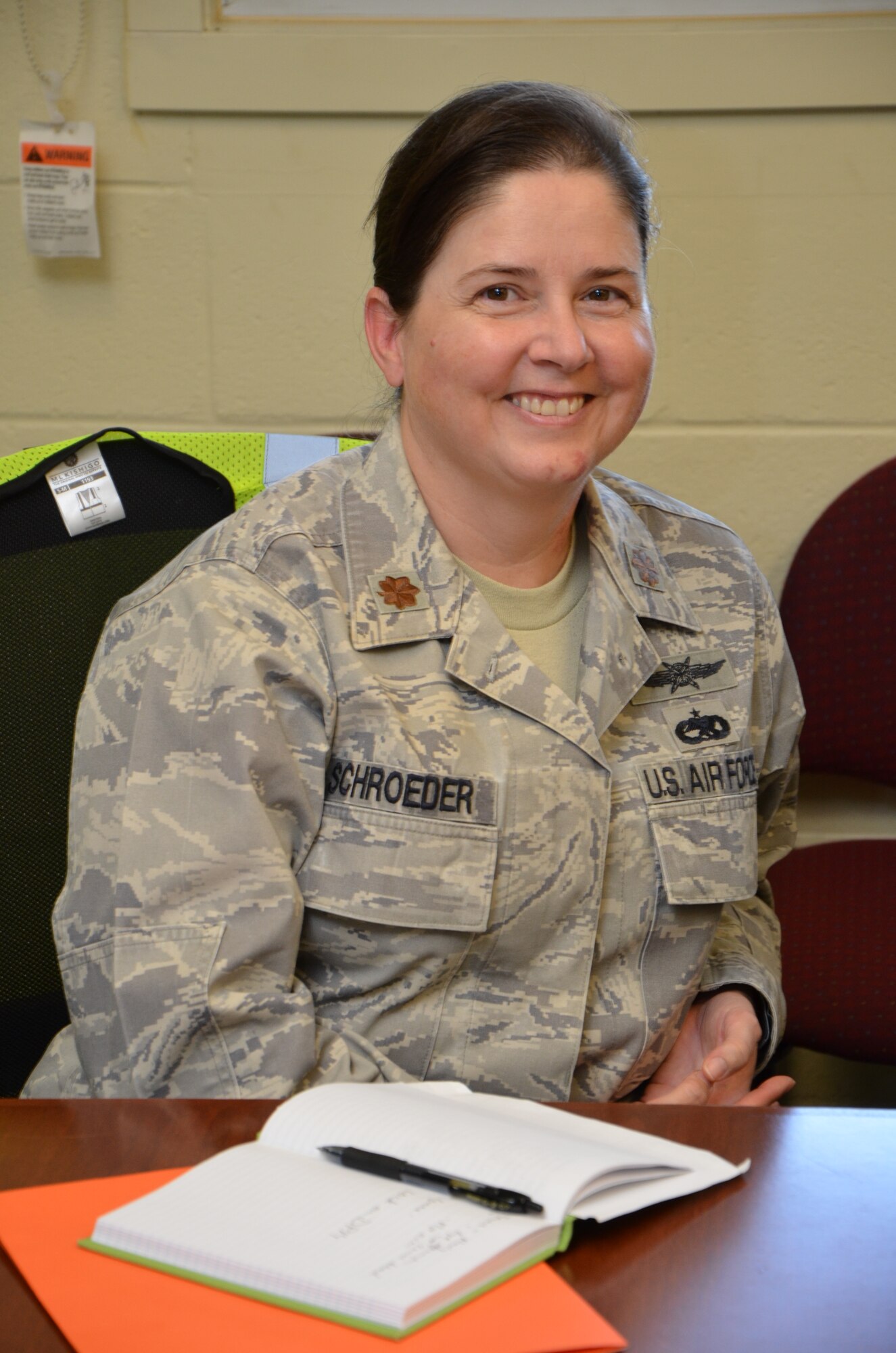 Maj. April Schroeder, acting inspector general and executive officer with the 624th Regional Support Group, poses for a photo at the end of an after-action discussion on the lessons learned from an active shooter exercise the unit staged during a unit training assembly, Joint Base Pearl Harbor-Hickam, Hawaii, Sept. 9, 2014. Schroeder said that in order to demonstrate the unit’s capabilities to perform their wartime mission they do exercises as outlined in Air Force Instruction 90-201, The Air Force Inspection System. (U.S. Air Force photo by Tech. Sgt. Phyllis Keith)