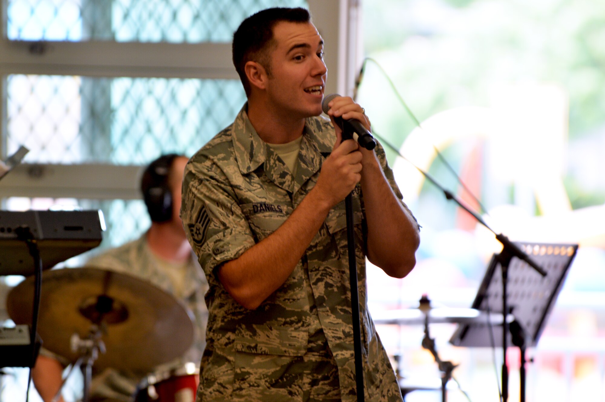 Staff Sgt. Nicholas Daniels, a vocalist with the U.S. Air Force Band of the Pacific-Hawaii, performs “Heart and Soul” by Twin Atlantic for Kapolei Elementary School students and faculty members in Kapolei, Hawaii, Nov. 5, 2014. The performance was part of the school’s observance of National Red Ribbon Week that raises awareness of the effects of drug use. (U.S. Air Force photo by Staff Sgt. Alexander Martinez)  