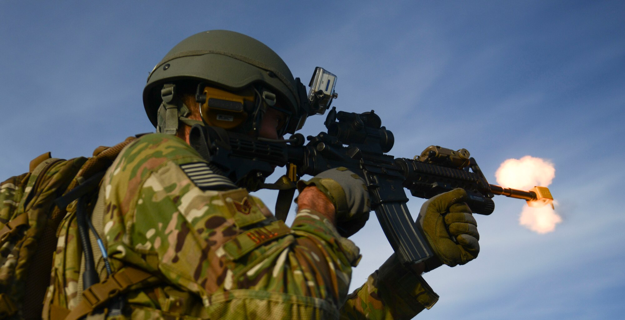 A Defender shoots blanks at simulated opposing forces during the Capstone Training Event at Saylor Creek Range, Idaho, Nov. 6, 2014. Security Forces worked closely with joint terminal attack controllers and the 1st Air Naval Gunfire Liaison Company during the training event. (U.S. Air Force photo by Airman 1st Class Malissa Lott/RELEASED)
