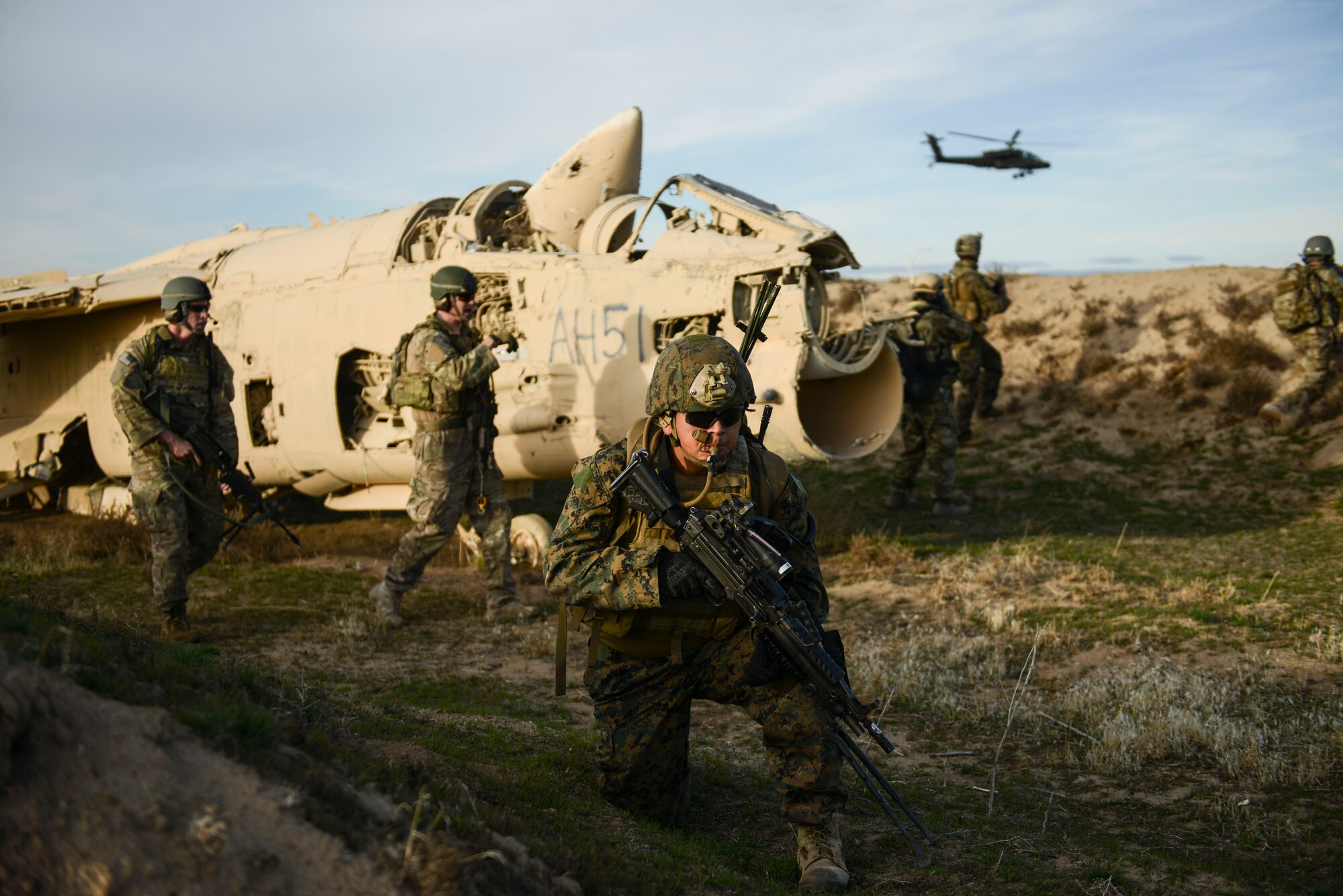 1st Air Naval Gunfire Liaison Company joint terminal attack controllers work with Air Force Security Forces during a joint force training event at Saylor Creek Range, Idaho, Nov. 5, 2014. Marines and Airmen worked closely during ground missions throughout the Capstone Training Event. (U.S. Air Force photo by Airman 1st Class Malissa Lott/RELEASED)
