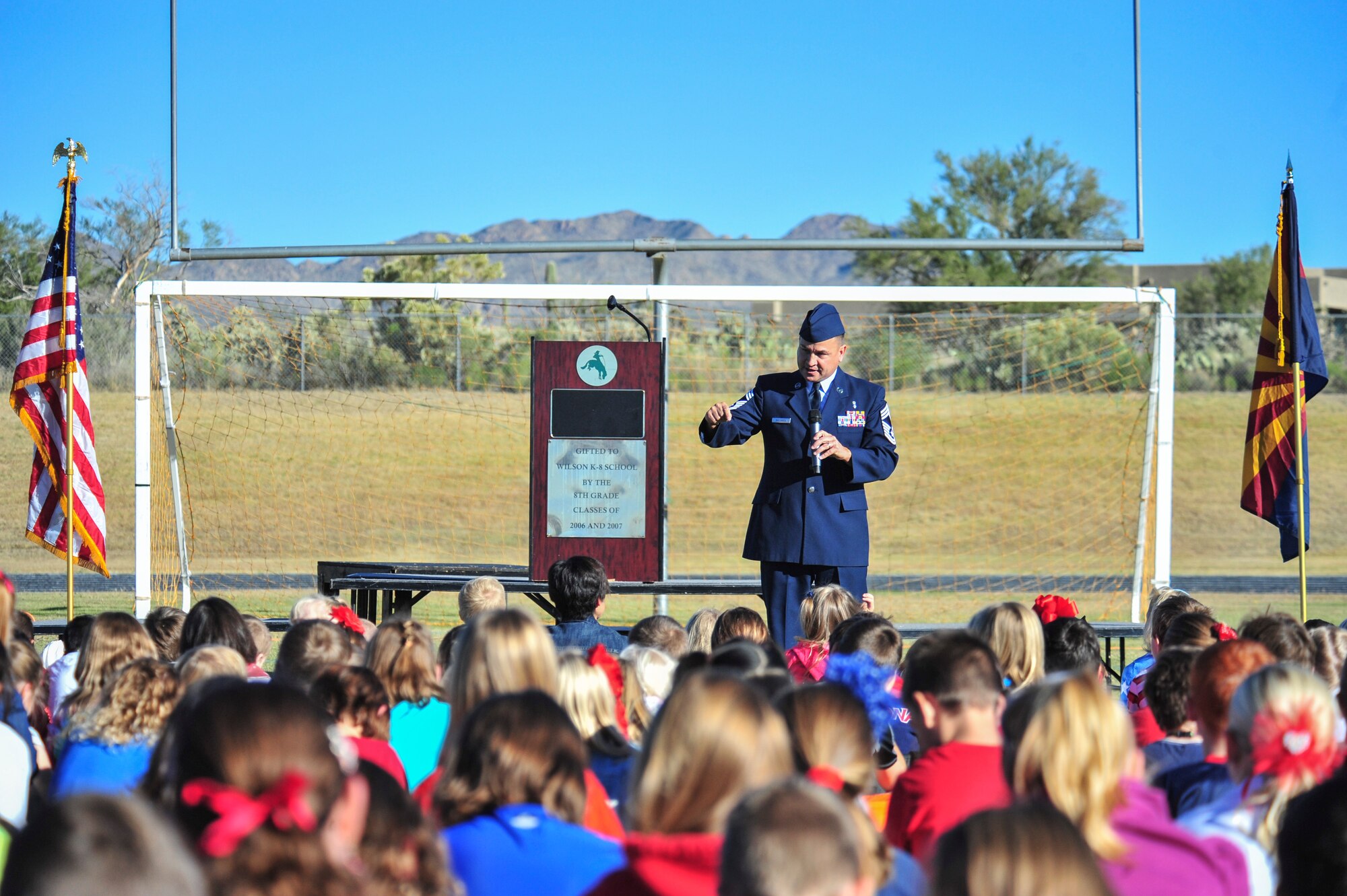 U.S. Air Force Chief Master Sgt. Chad Ballance, 355th Medical Group superintendent, during a Veterans Day Assembly at Richard B. Wilson K-8 School, Tucson, Ariz., Nov. 7, 2014.  Ballance spoke to a crowd of more than 1,500 students, teachers and veterans about remembering the veterans who paid the ultimate sacrifice protecting the safety and freedoms of the U.S.  (U.S. Air Force Photo by Airman 1st Class Chris Massey/Released)