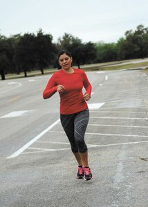 Tech Sgt. Rebeca Mendoza, 433rd Medical Squadron education and training manager, runs around the Gateway Fitness Center Nov. 6. Mendoza is training to compete in the San Antonio Rock ‘n’ Roll Half-Marathon Dec. 7 (photo by Staff Sgt. Marissa Garner).