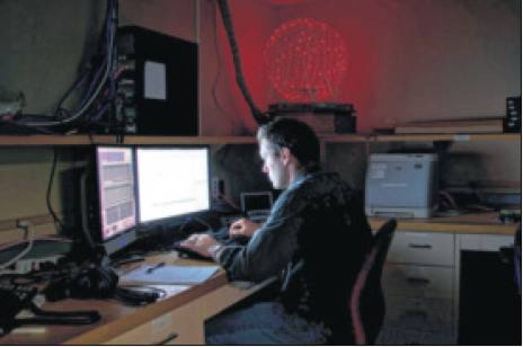 Romigh tests the technology in a specially designed, sound proof audio lab at Wright-Patterson AFB. (Air Force photos by Richard Eldridge)