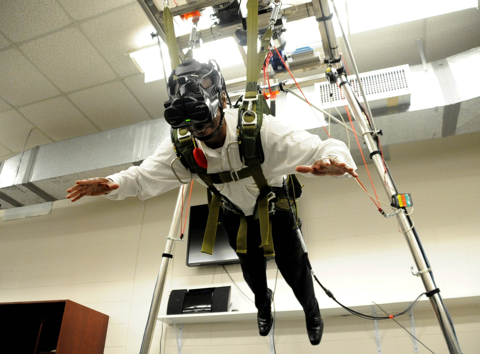 Charleston civic leader, Jamal Middleton takes his first free fall using the Joint Communications Support Element parachute riggers simulator, MacDill Air Force Base, November 5. The simulator is used to hone para-commandos abilities and skills. (U.S. Air Force photo by Staff Sgt. Adam C. Borgman)