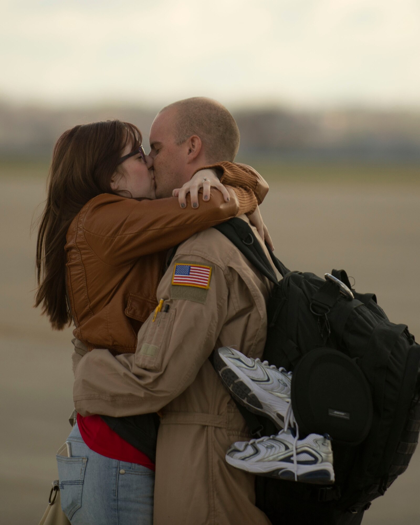 Staff Sgt Travis Green, 109th Aerial Squadron, reunites with his spouse in St. Paul, Minn., Nov. 6, 2014.  Staff Sgt. Green returned to Minnesota after a four month deployment to Southwest Asia in support of Operation Enduring Freedom. (U.S. Air National Guard photo by Tech. Sgt. Amy M. Lovgren/ Released)