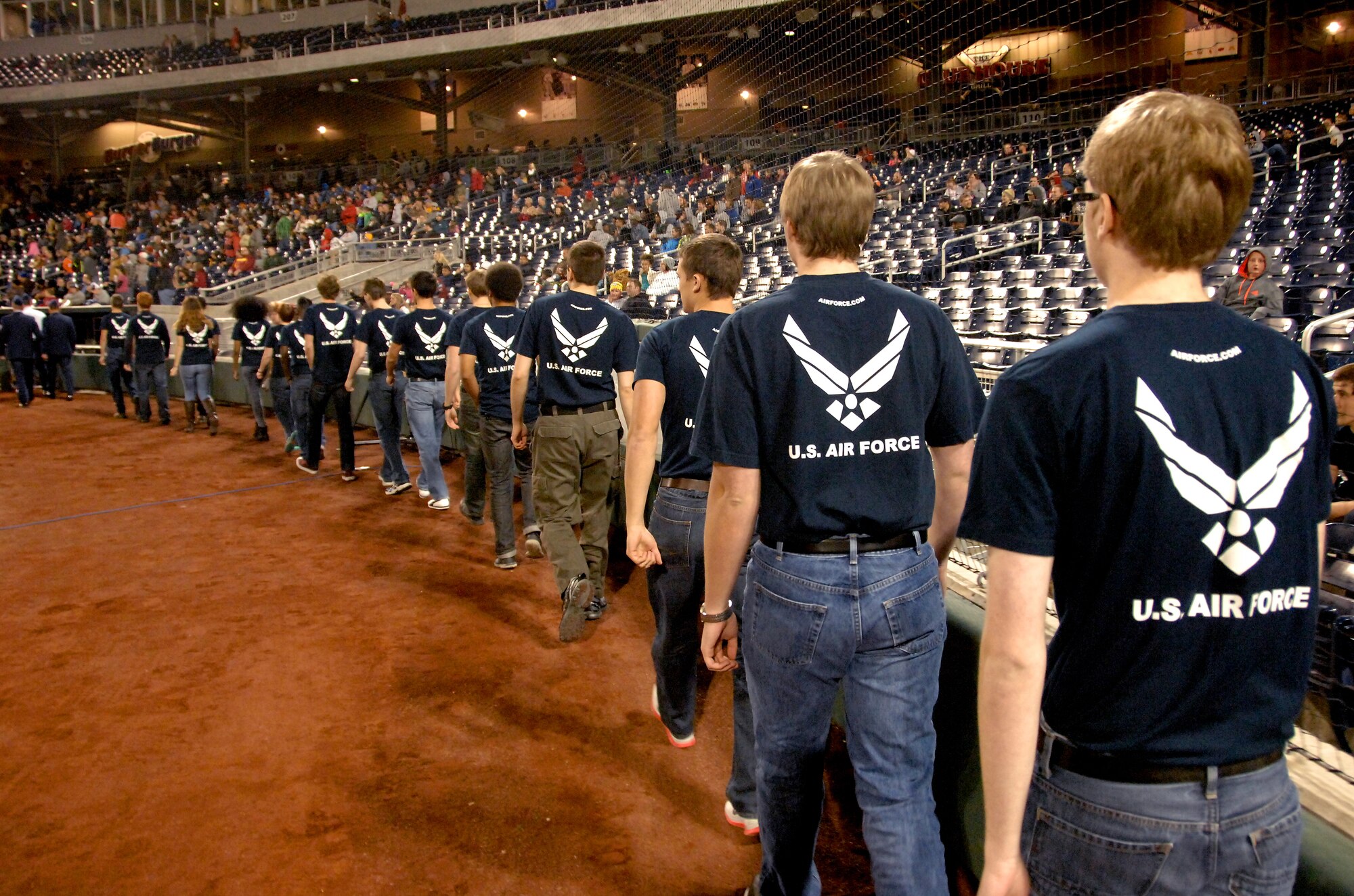 Air Force recruits prepare to take the field for a swearing in ceremony that was conducted at halftime of an Omaha Mammoths football game held at TD Ameritrade Park in downtown Omaha, Nebraska Nov. 5. Active duty members from Offutt along with Air Force recruits attended the game as part the Mammoths Military Appreciation Night. (U. S. Air Force photo by Delanie Stafford)