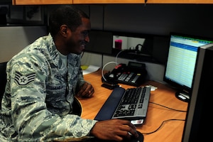 U.S. Air Force Staff Sgt. Robert James, 438th Supply Chain Operations Squadron Mission Capable Team Two noncommissioned officer in charge, completes his daily requirements at Langley Air Force Base, Va., Nov. 6, 2014. Airmen of the 438th SCOS are responsible for providing global logistics support to the warfighters both at home stations and in deployed locations. (U.S. Air Force photo by Airman 1st Class Areca T. Wilson/Released) (Photo blurred for security purposes) 
