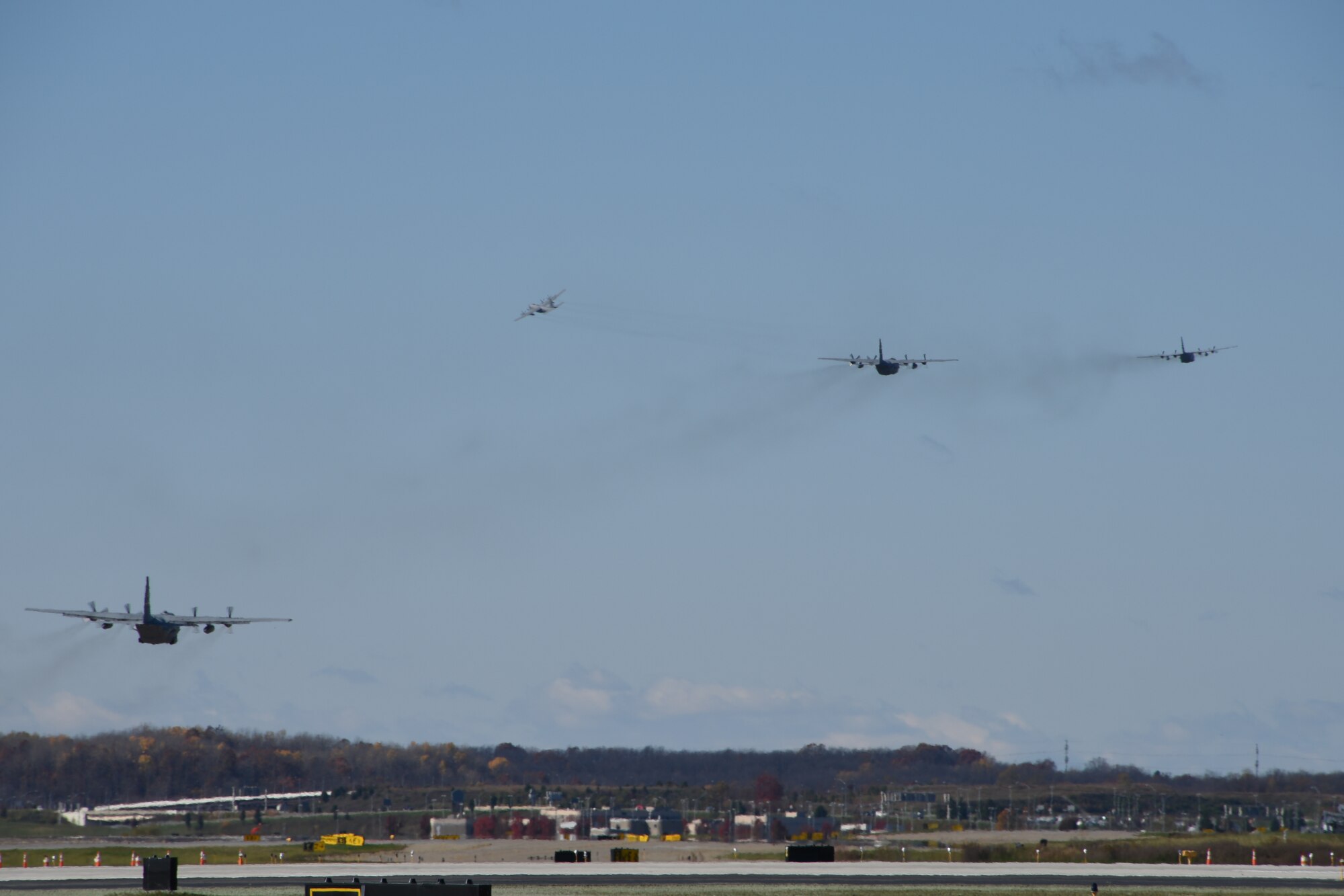 Four C-130 Hercules aircraft take off simultaneously from Pittsburgh International Airport Air Reserve Station during a flight generation exercise, Nov. 01, 2014. A flight generation exercise ensures that all facets of the 911th Airlift wing are mission ready at a moment’s notice to get in the fight. (U.S. Air Force photo by Senior Airman Joshua J. Seybert)