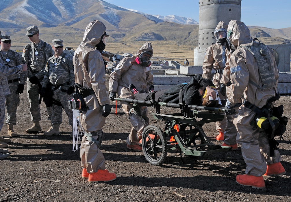 Members of the Utah National Guard Chemical, Biological, Radiological, Nuclear (CBRN) Enhanced Response Force Package (CERFP) and Homeland Response Force (HRF) extract and treat mock casualties from a simulated rubble pile in Magna, Utah during Vigilant Guard on November 4, 2014. The training exercise simulated a building collapse and chemically contaminated area as part of an earthquake disaster scenario. (Air National Guard photo by Staff Sgt. Annie Edwards/RELEASED)