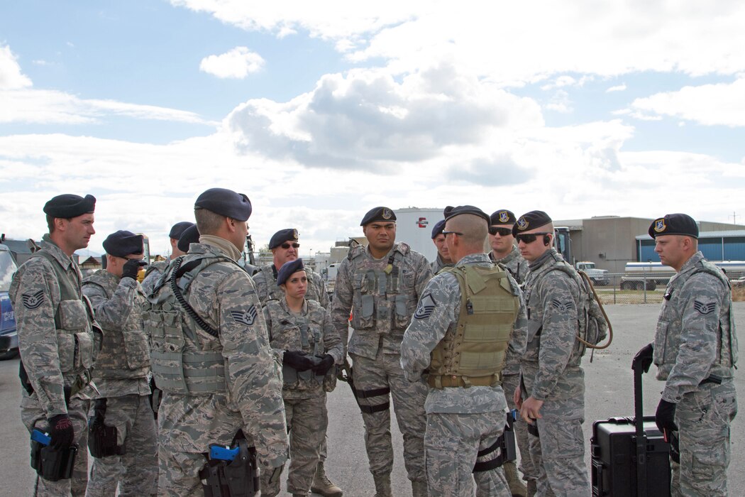 Master Sgt. Brian Atchley briefs members of the 151st Air Refueling Wing Security Forces Squadron as they prepare to assist in securing Questar Village in Salt Lake City, Utah  as part of a training exercise during Vigilant Guard on November 3, 2014. (U.S. Army photo by Sgt. Christopher Lennox/Released)