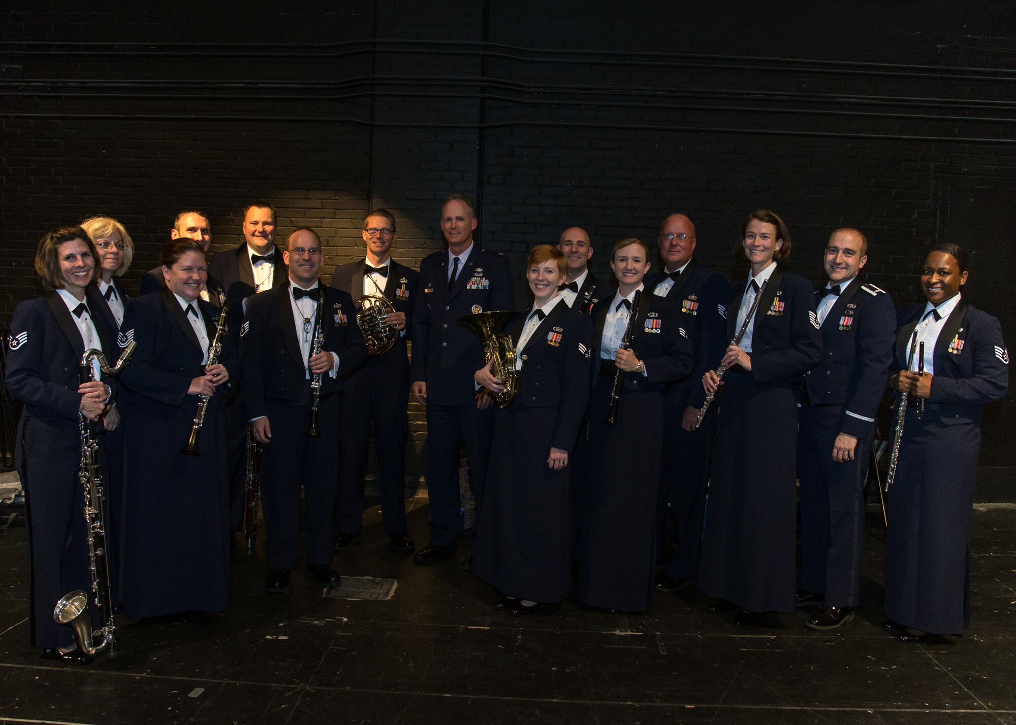 LEXINGTON, Mass. - Langley Winds Airmen-musicians pose with Col. Michael A.
Vogel, 66th Air Base Group commander, before a performance at Lexington High
School Nov. 6.  The Langley Winds features Musicians who have earned
worldwide acclaim and military distinction. (U.S. Air Force Photo Walter
Santos)

