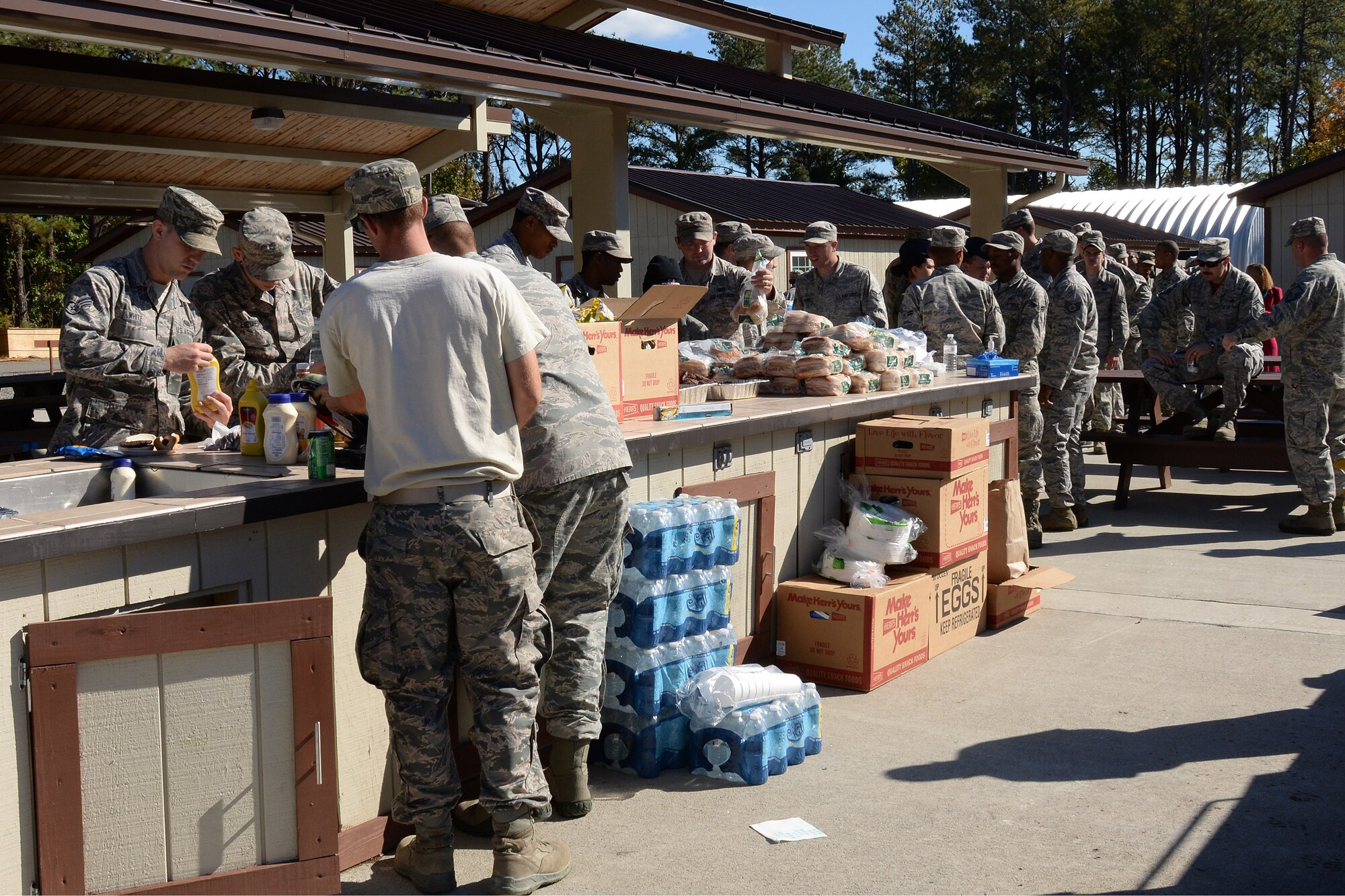U.S. Air Force Airmen fill their plates during an appreciation barbeque at the Langley Transit Center at Langley Air Force Base, Va., Nov. 7, 2014. The barbeque was hosted to thank Airmen from all squadrons that assisted with the renovations to the LTC. (U.S. Air Force photo by Staff Sgt. Teresa J. Cleveland)