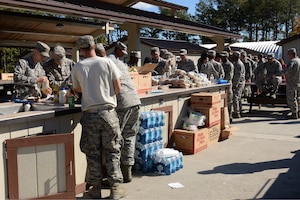U.S. Air Force Airmen fill their plates during an appreciation barbeque at the Langley Transit Center at Langley Air Force Base, Va., Nov. 7, 2014. The barbeque was hosted to thank Airmen from all squadrons that assisted with the renovations to the LTC. (U.S. Air Force photo by Staff Sgt. Teresa J. Cleveland)
