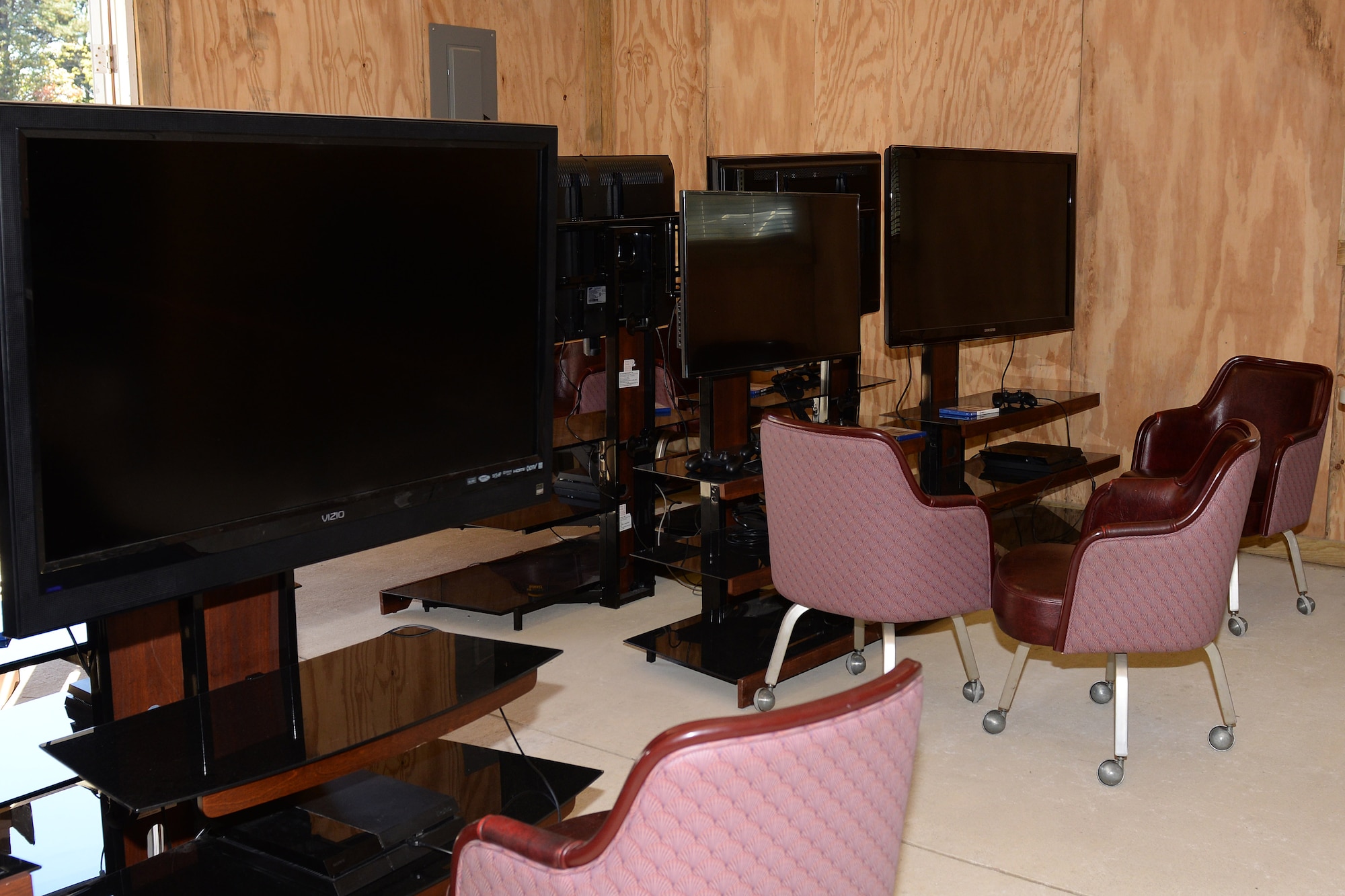 The Langley Transit Center’s entertainment and recreation room, known as ‘The Hub,’ shown here on Nov. 7, 2014, includes video game consoles, flat screen televisions, and computers with video-chat capabilities. In order to keep Service members connected to loved ones, technicians from the 633rd Air Base Wing built a Wi-Fi internet network servicing the entire transit center for them to tap into for communication and entertainment purposes. (U.S. Air Force photo by Staff Sgt. Teresa J. Cleveland/Released)