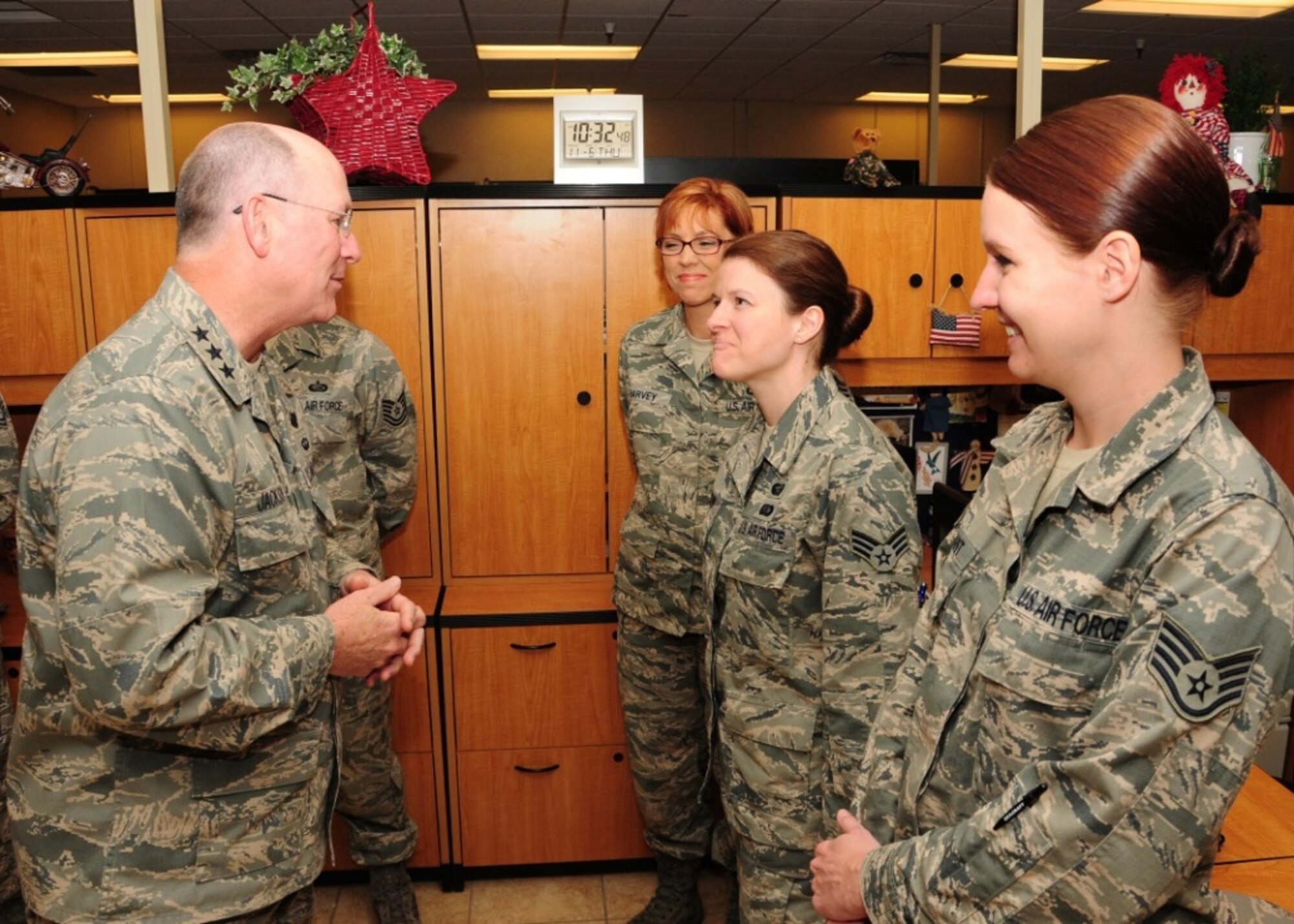 Lt. Gen. James “JJ” Jackson, Air Force Reserve Command commander, talks with 944th Force Support Squadron Airmen Nov. 6 during his tour of the 944th Fighter Wing at Luke Air Force Base, Ariz. (from left to right) Chief Master Sgt. Michelle Harvey, 944th FSS superintendent; Senior Airman Melinda Charlton, 944 FSS personnel apprentice; and Staff Sgt. Jennifer Dimant, 944 FSS personnel-career development. (U.S. Air Force photo taken by Tech. Sgt. Louis Vega Jr.)