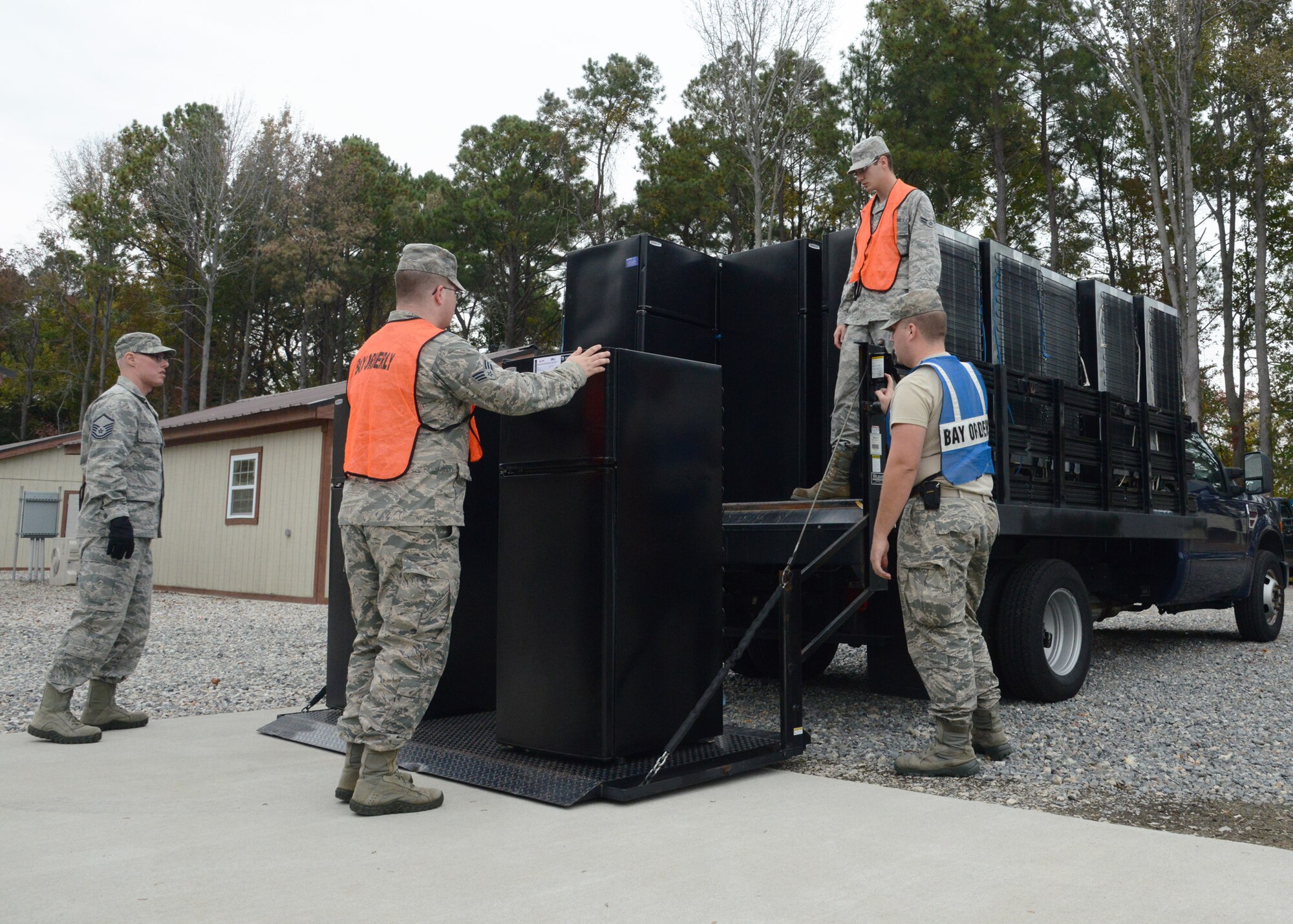 U.S. Air Force Airmen from the 633rd Air Base Wing unload refrigerators at the Langley Transit Center at Langley Air Force Base, Va., Nov. 5, 2014. Each dormitory at the transit center features furniture, refrigerators and telephones to provide a comfortable experience for U.S. Service members returning from Ebola response missions in West Africa that are undergoing the Department of Defense-mandated 21-day  controlled monitoring period. (U.S. Air Force photo by Staff Sgt. Jason J. Brown/Released)