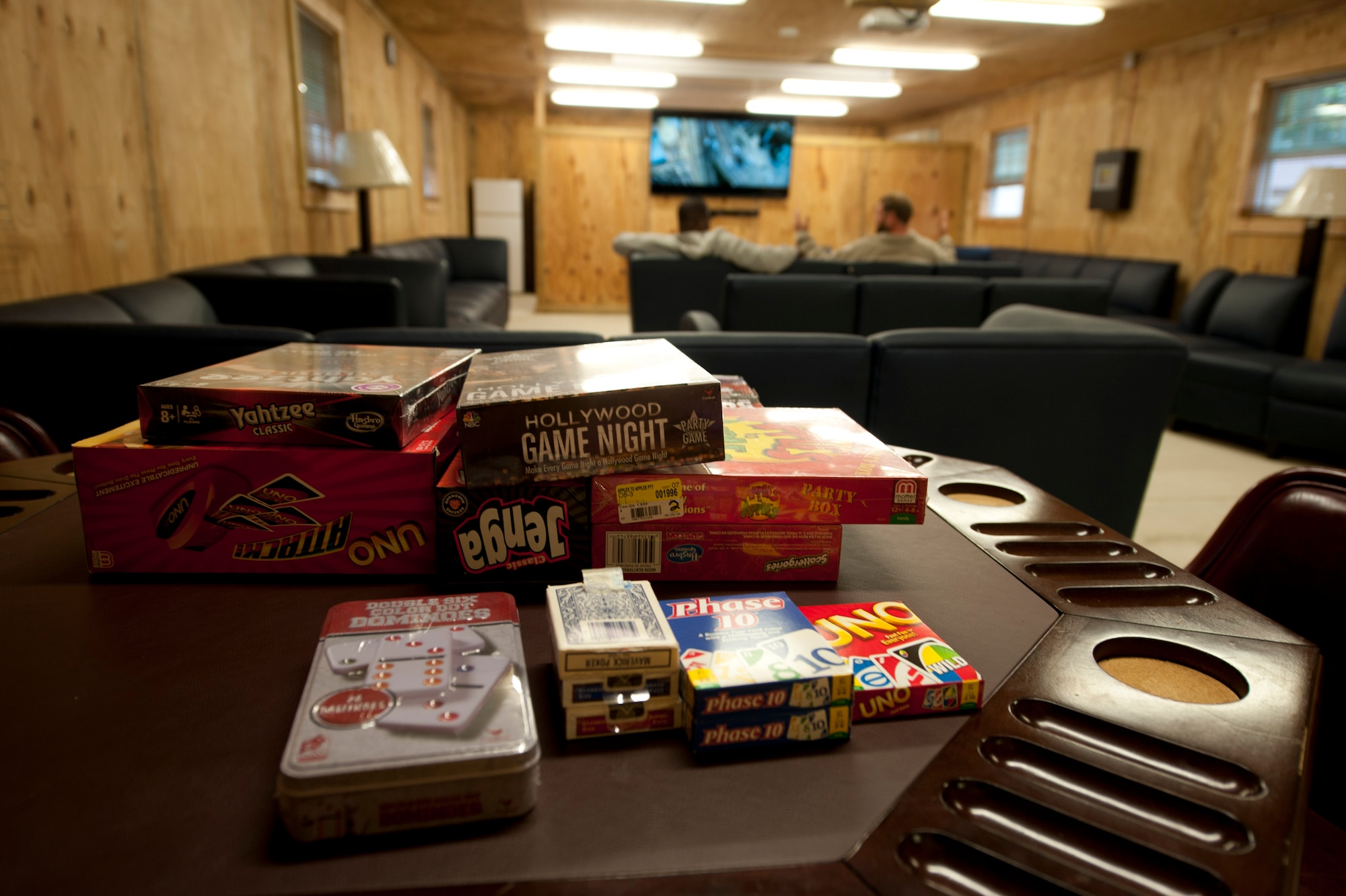 Contractors take a break from working on the entertainment room, called  “the Hub,” at the Langley Transit Center at Langley Air Force Base, Va., Nov. 6, 2014. The Hub features board games, computers, television sets, and video game consoles. Other recreational activities are also available for use during the Service members’ 21-day controlled monitoring period at the center.  (U.S. Air Force photo by Staff Sgt. Natasha Stannard/Released)
