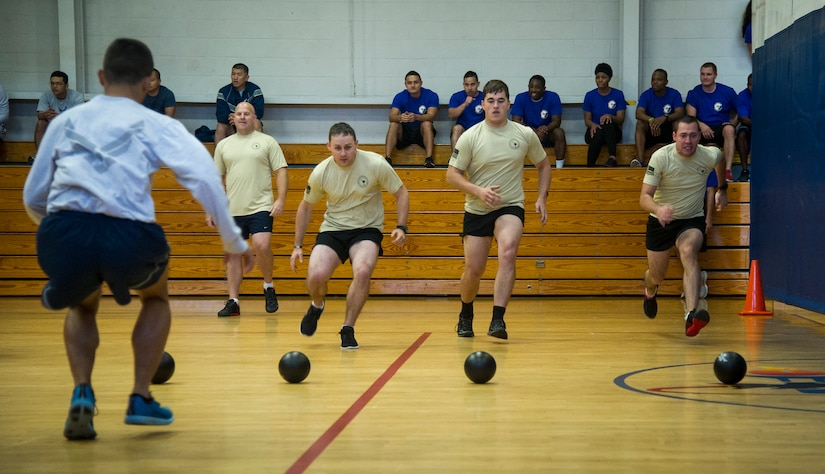 Joint Base Charleston Airmen participate in the monthly fitness challenge Nov. 7, 2014, at the Air Base fitness center on Joint Base Charleston, S.C. The monthly fitness challenge is a 628th Air Base Wing initiative intended to encourage teamwork and camaraderie as part of Comprehensive Airmen Fitness. (U.S. Air Force photo/Airman 1st Class Clayton Cupit)