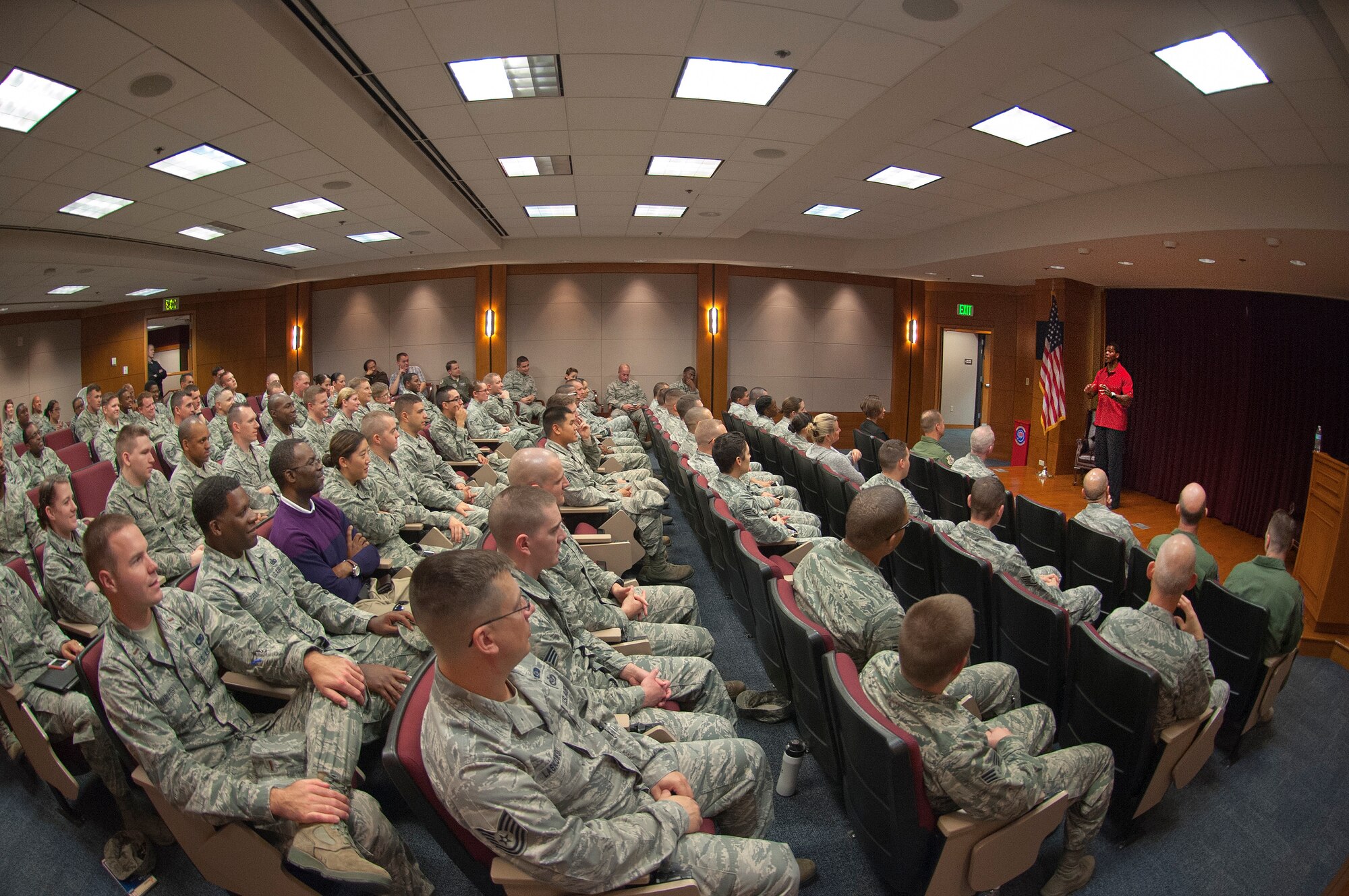 Heisman Trophy winner and National Football League great Herschel Walker speaks to Travis Air Force Base, Calif., Airmen during his recent visit. Walker gave presentations to Airmen about his bouts with mental illness and the importance of seeking help along with fighting the stigma related to mental illness. (U.S. Air Force photo by T.C. Perkins Jr.)