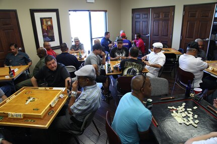 Attendees of the 14th annual Rafael Rodriguez Dominos Tournament begin to play elimination rounds that will eventually decide the victor Oct. 25 at the Joint Base San Antonio-Randolph community center. (U.S. Air Force photo by Airman 1st Class Alexandria Slade)
