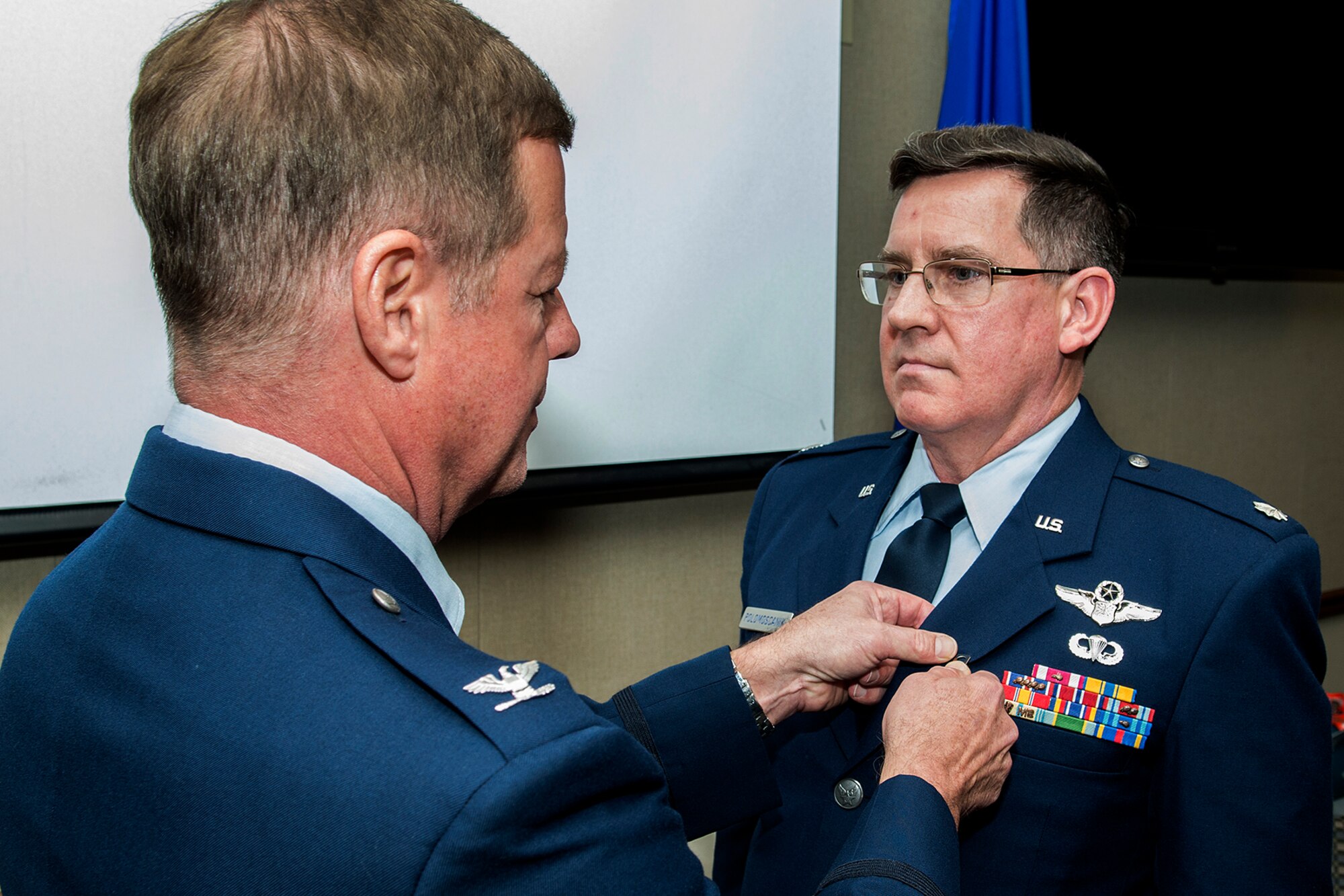 U.S. Air Force Lt. Col. Ronald Polomoscanik is awarded the Air Force Meritorious Service Medal during his retirement ceremony on Nov. 2, 2014, Barksdale Air Force Base, La. Polomoscanik received the award for outstanding service to the United States while assigned to the 343rd Bomb Squadron at Barksdale. (U.S. Air Force photo by Master Sgt. Greg Steele/Released)